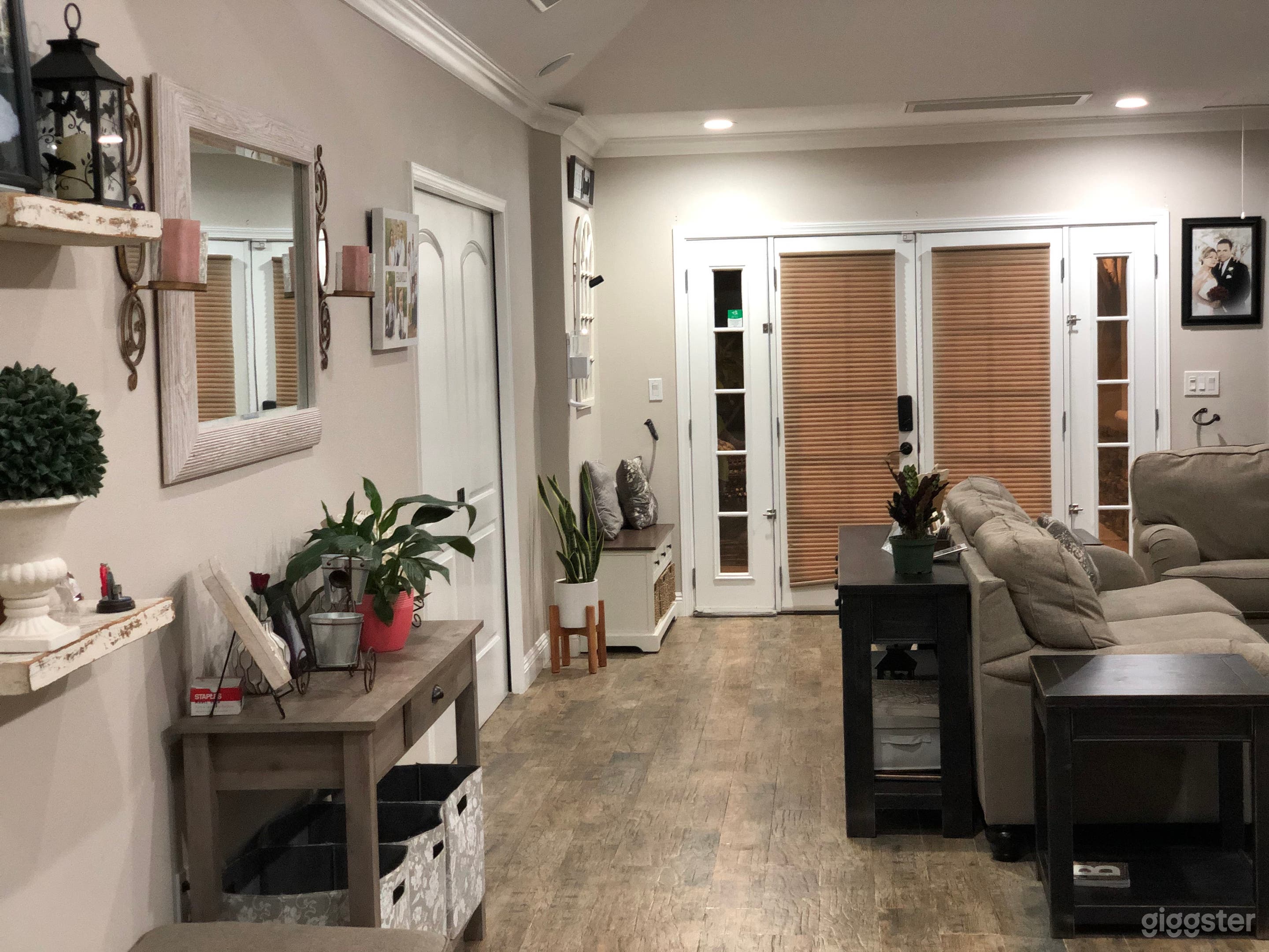Living Room with vaulted ceiling and built-in speakers. Electric Fire place on the right side. 