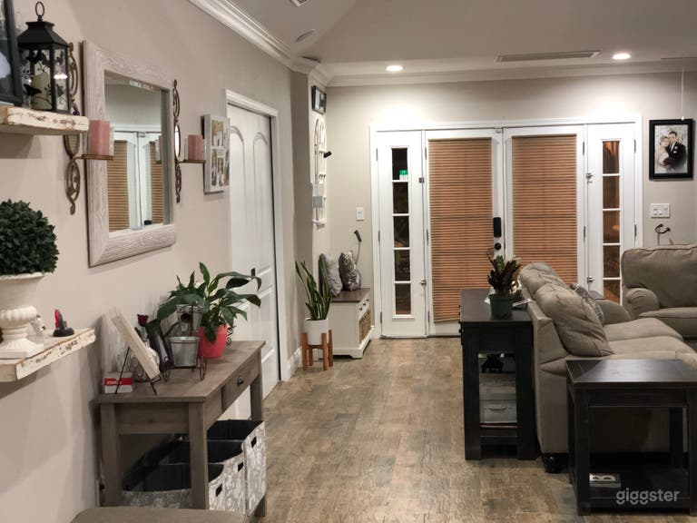  Living Room with vaulted ceiling and built-in speakers. Electric Fire place on the right side.  