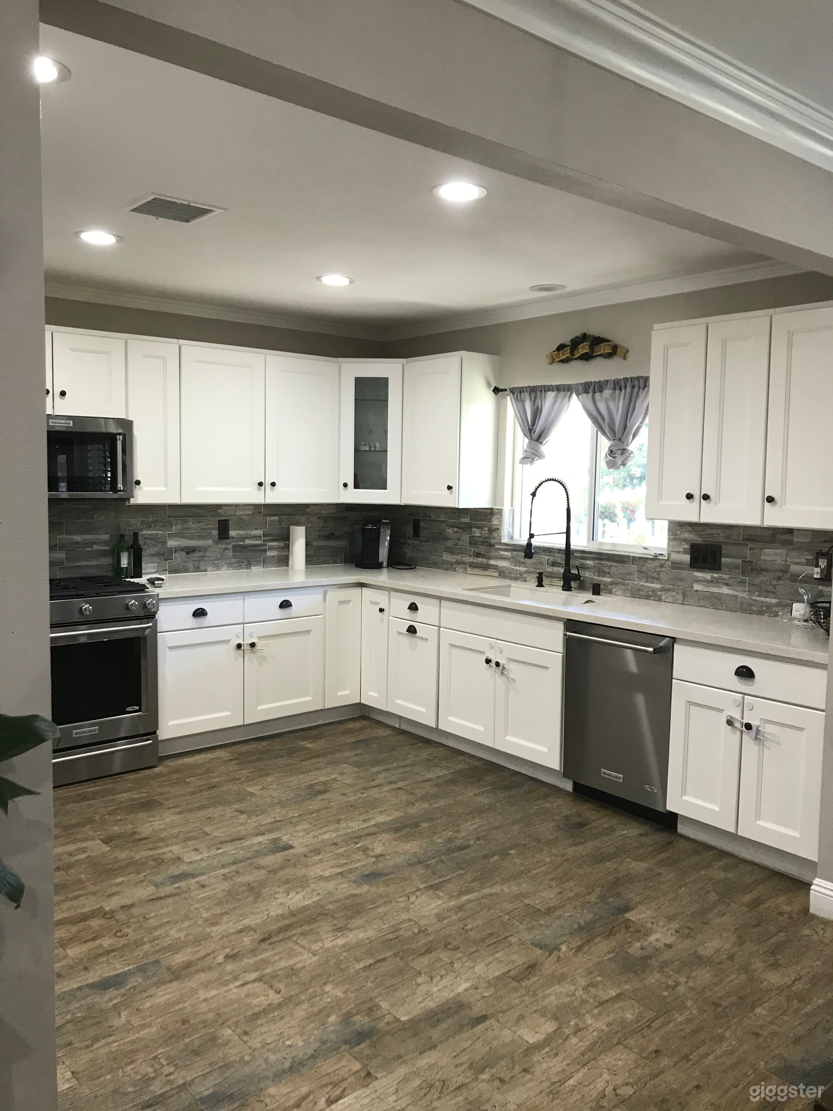 Spacious Kitchen with white cabinets 