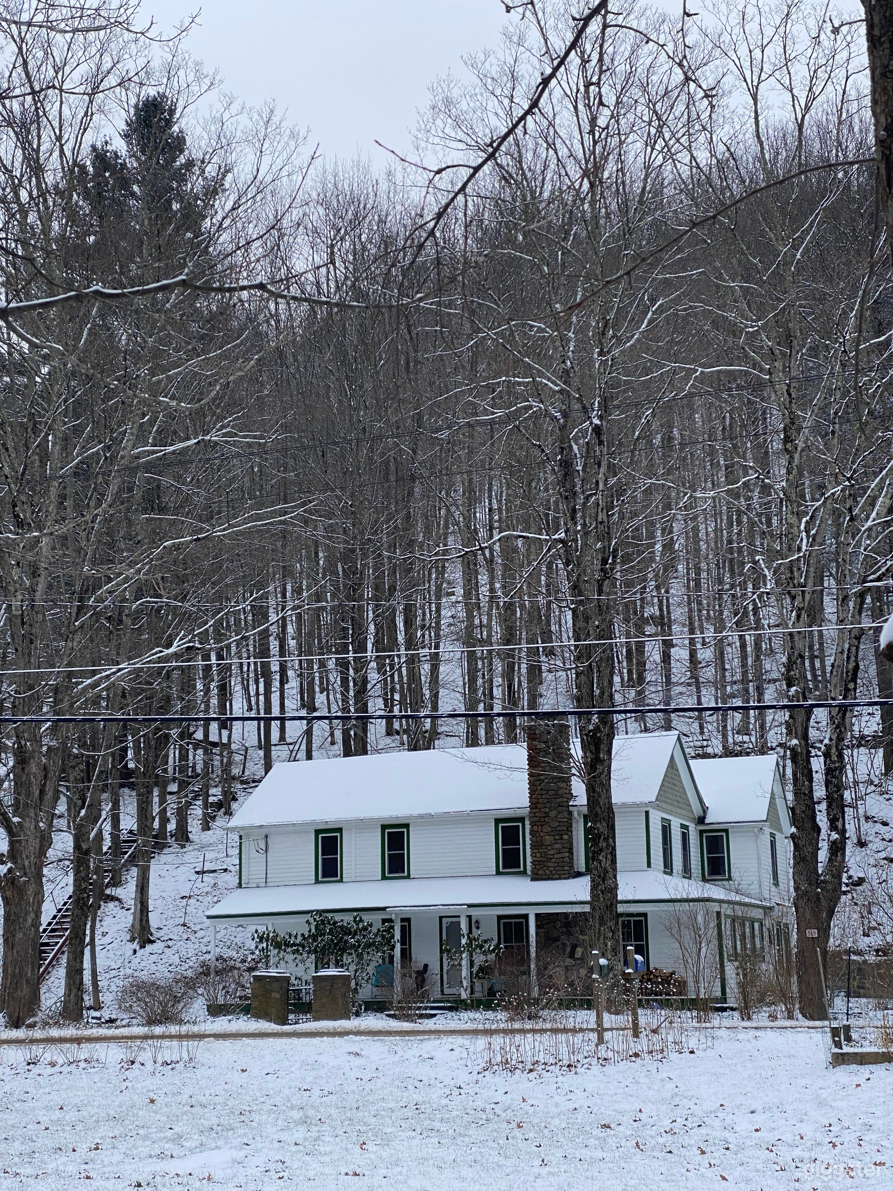 Front of house which shows the mountain land behind us. In total there are 5.6 acres on this property with clearings and ancient stone formations dotting the property. 