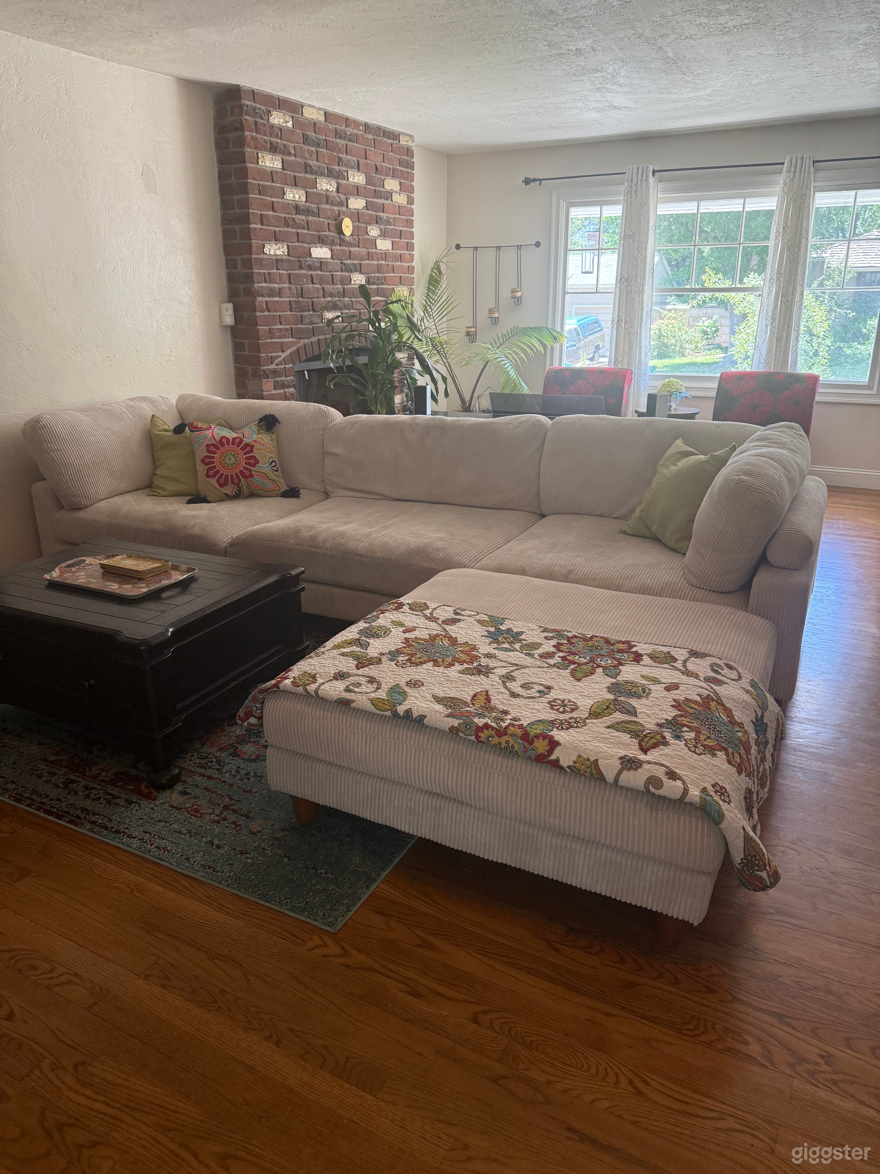 The living room has good light all day from morning until late afternoon.