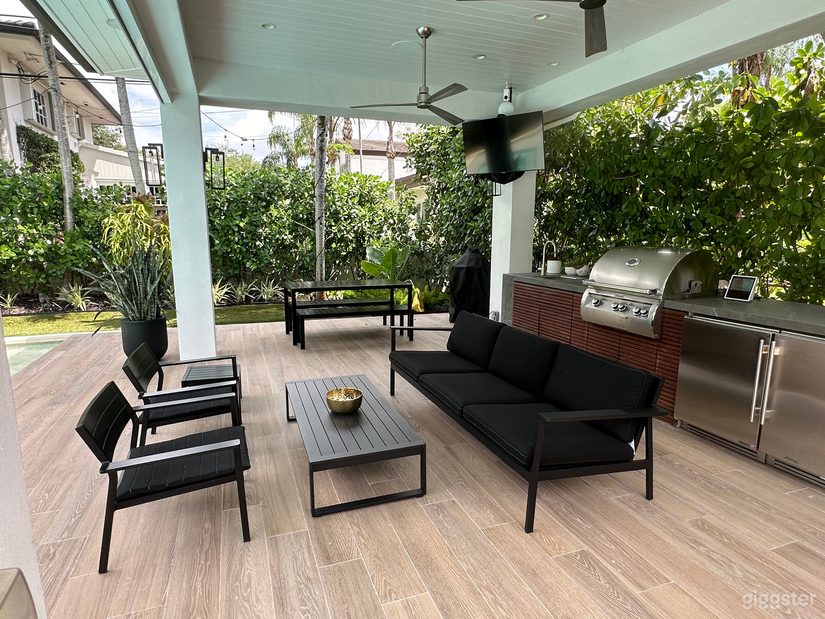 Sofa and chairs to relax in the gazebo.