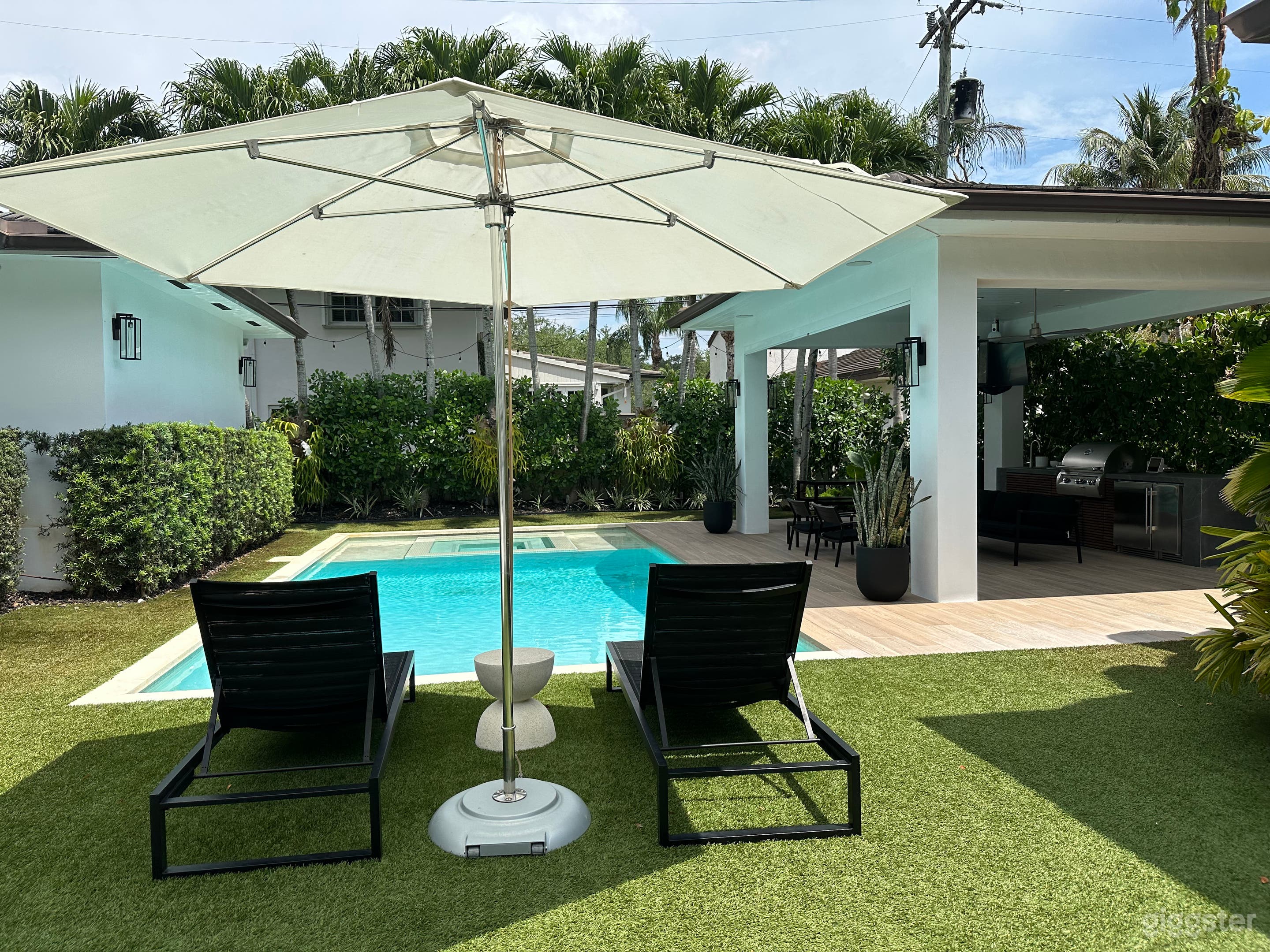 Lounge chairs and sun umbrella.