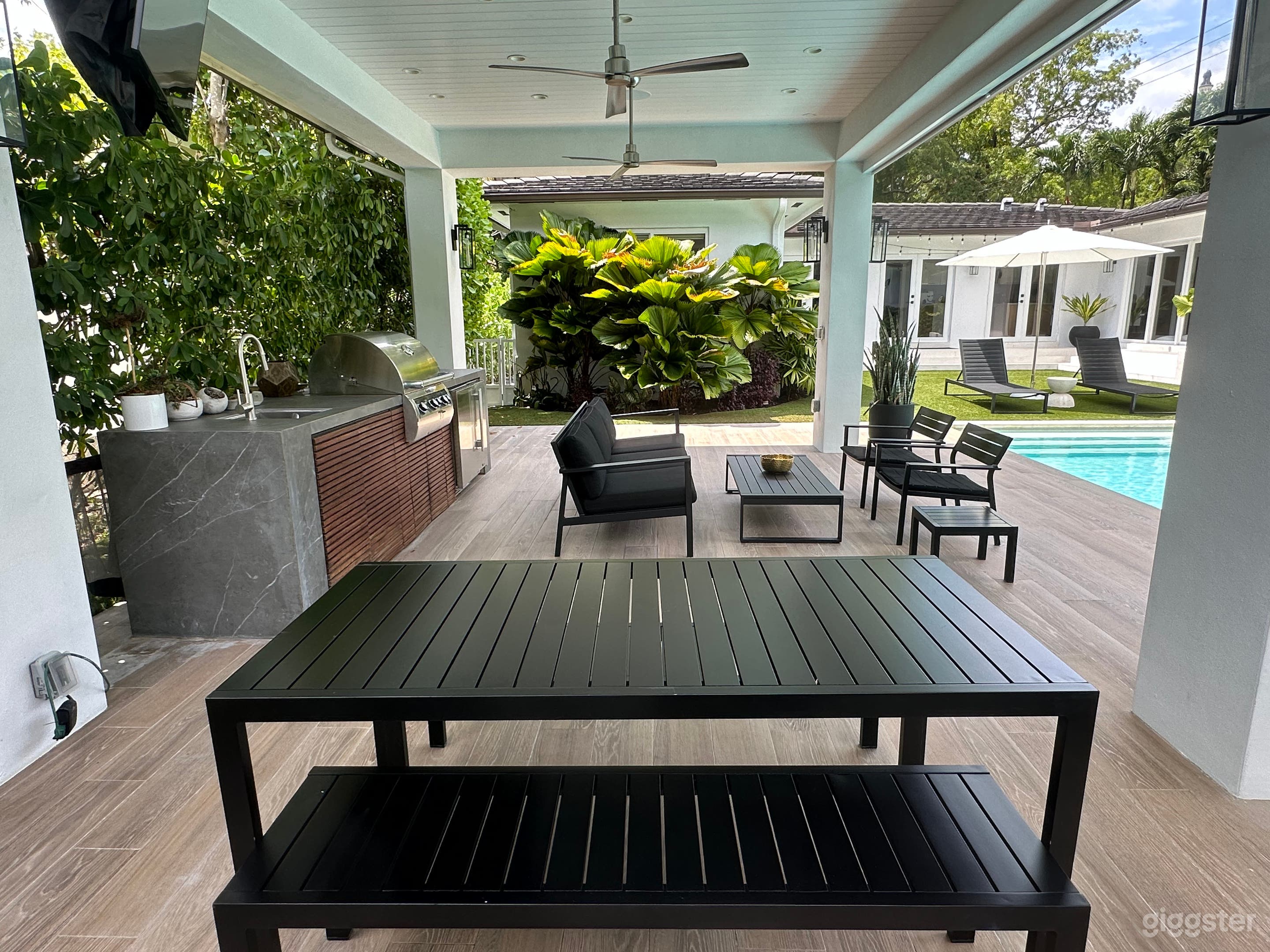 Gazebo table with benches and sofa to relax.