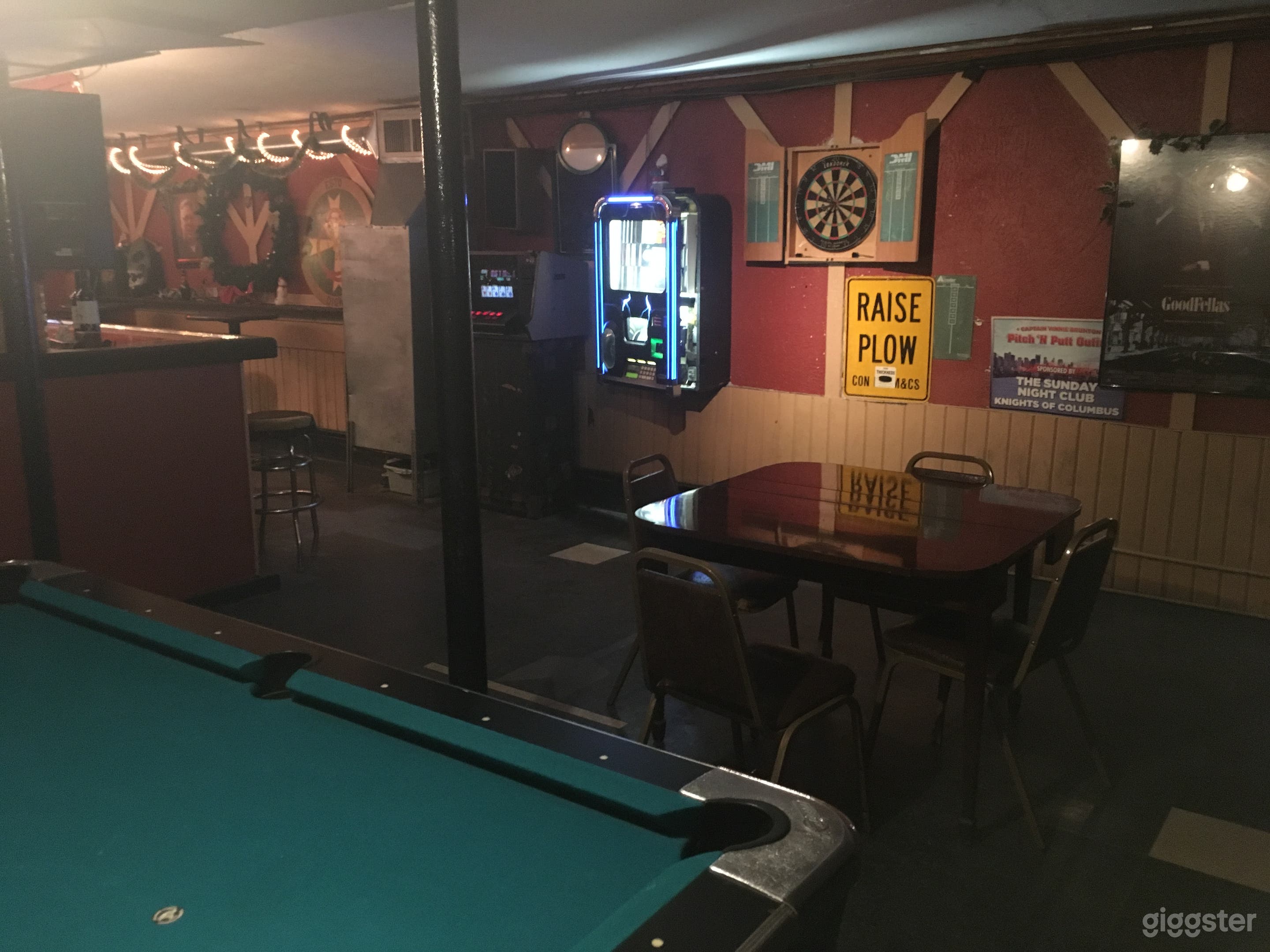 Pool/darts area next to the basement bar.