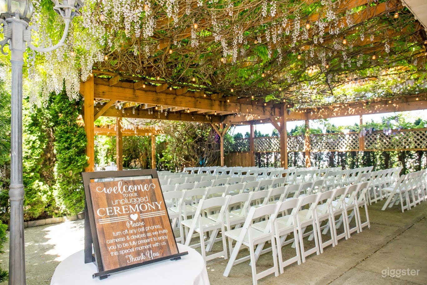 Wisteria Courtyard with beautiful wooden trellis Photo 1