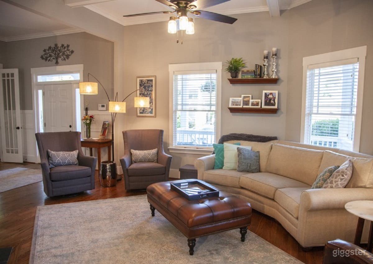 Unique angled living room with custom made conversational couch.