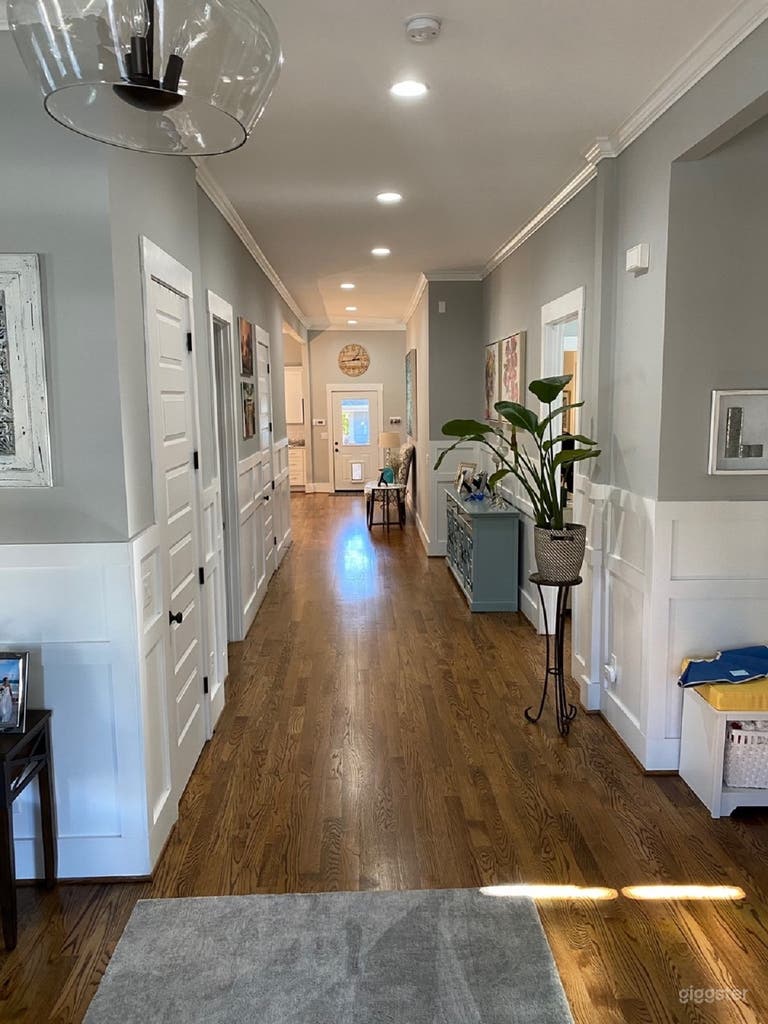  Entering the home, you are welcomed by a grand hallway  featuring 11.5&#x27; ceilings.   