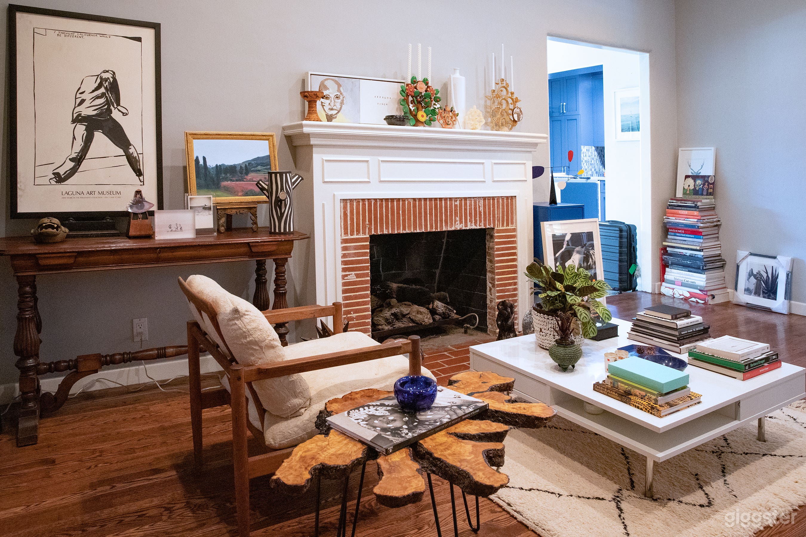 Library Sitting Room with Fireplace + Built-In Bookcase with Ladder (Day)