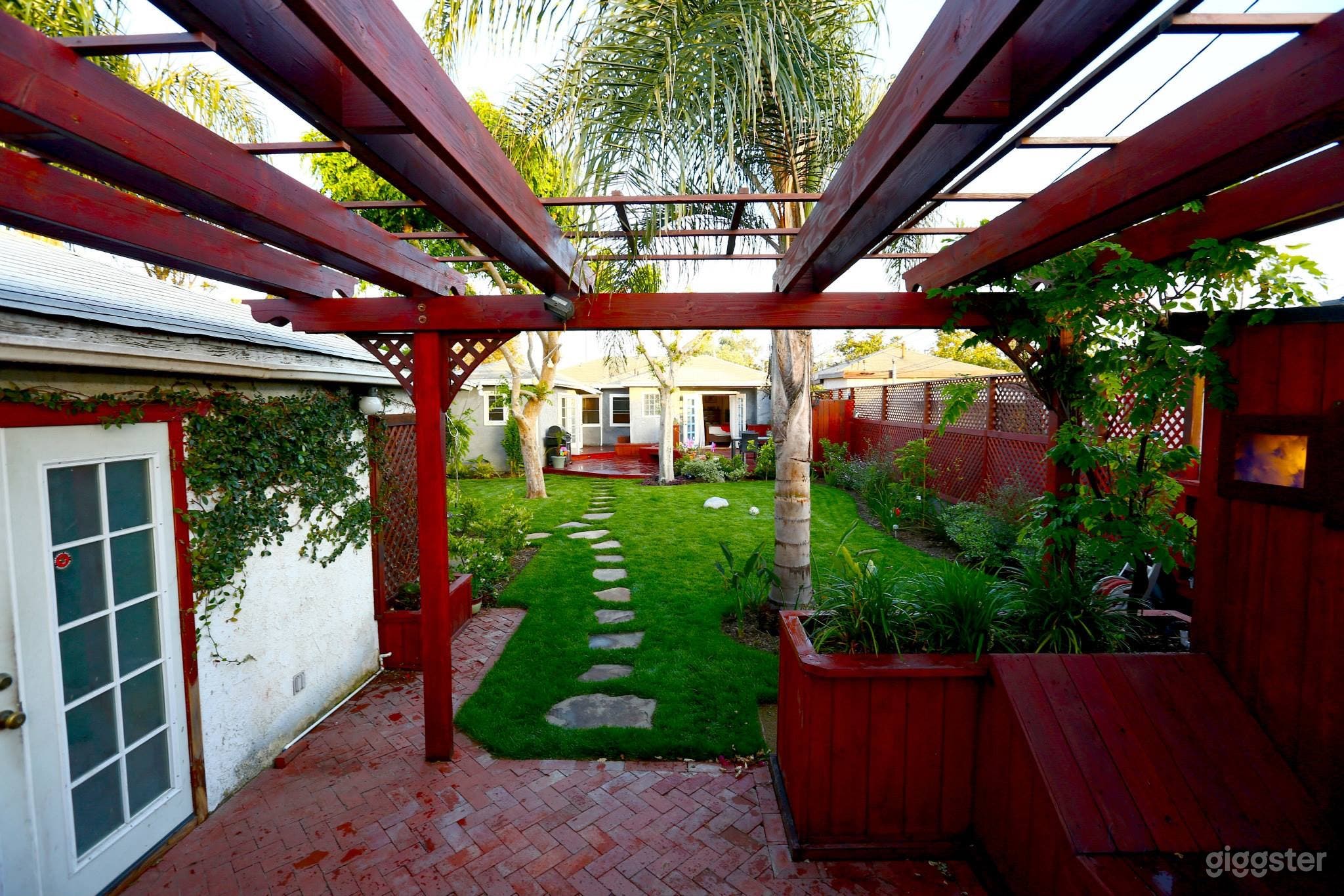 That door in the left is a garage turned modern office with AC and internet .  Great place for a production office or a workspace for many people.  Huge property it’s a corner lot.