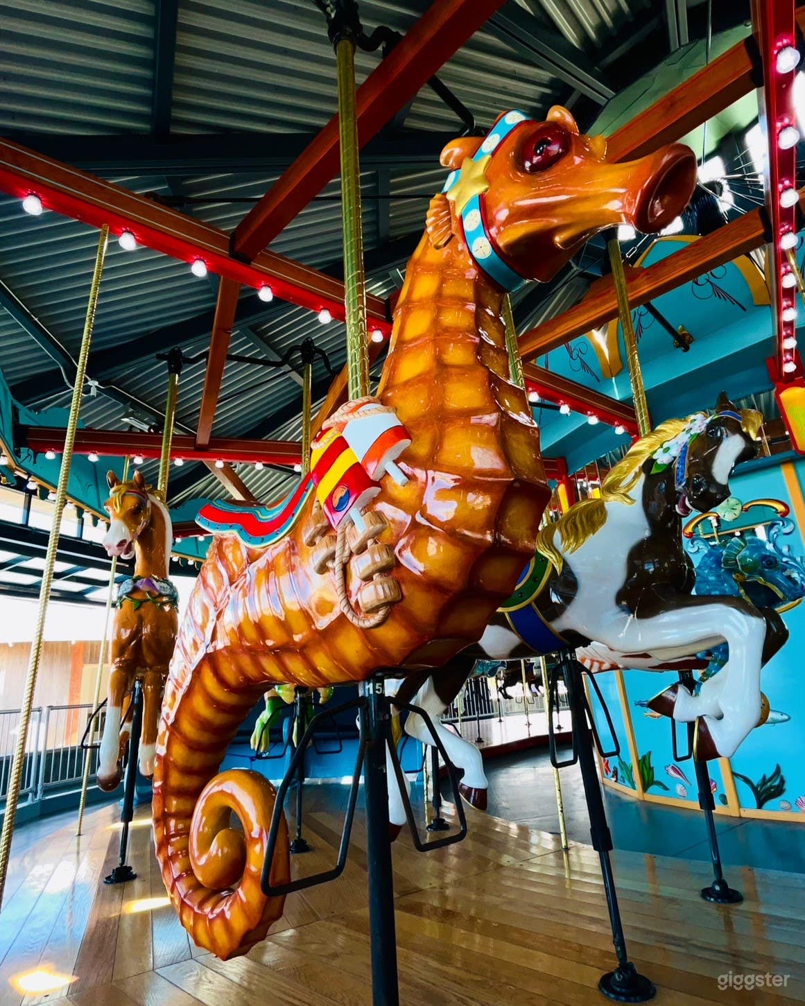 Traditional carousel horses and sea themed animals