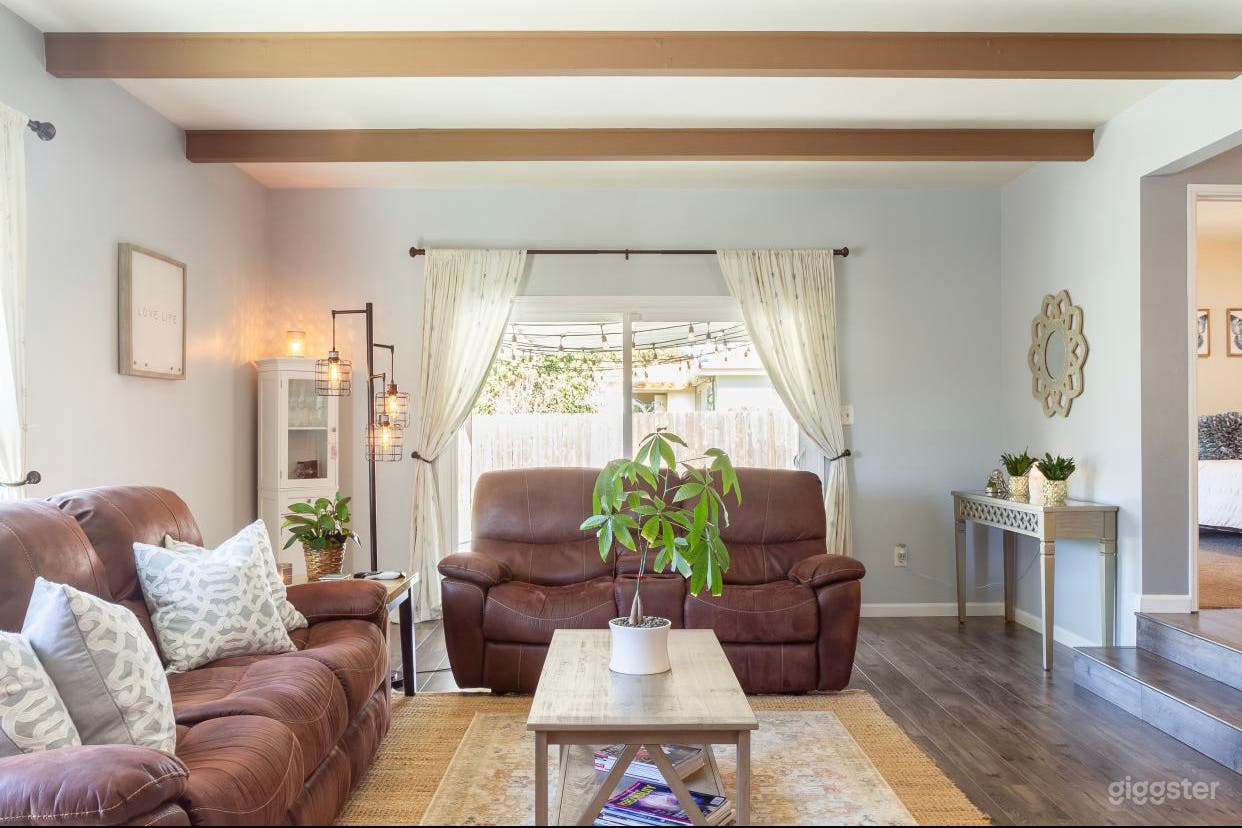 Family Room with High Ceilings with exposed beams 