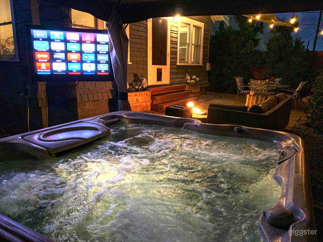 The private backyard with jacuzzi and fire-pit. 