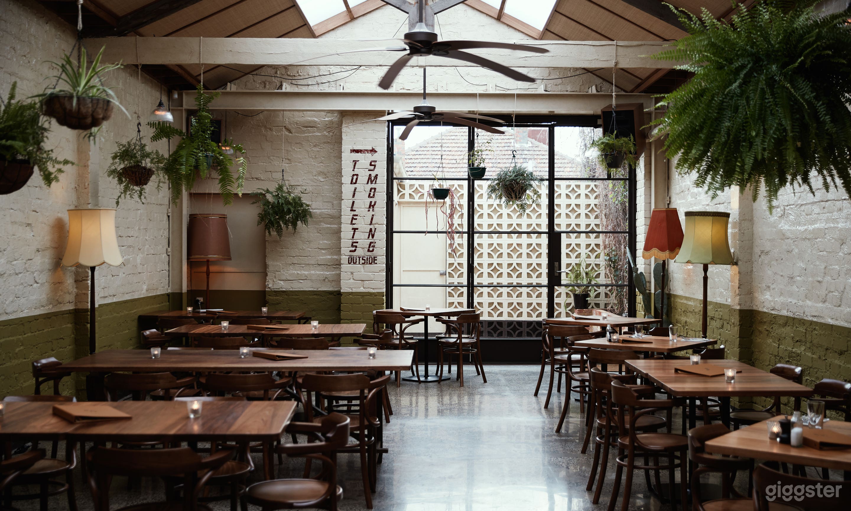 Fern room dining area. Lots of natural light &amp; hanging plants.
