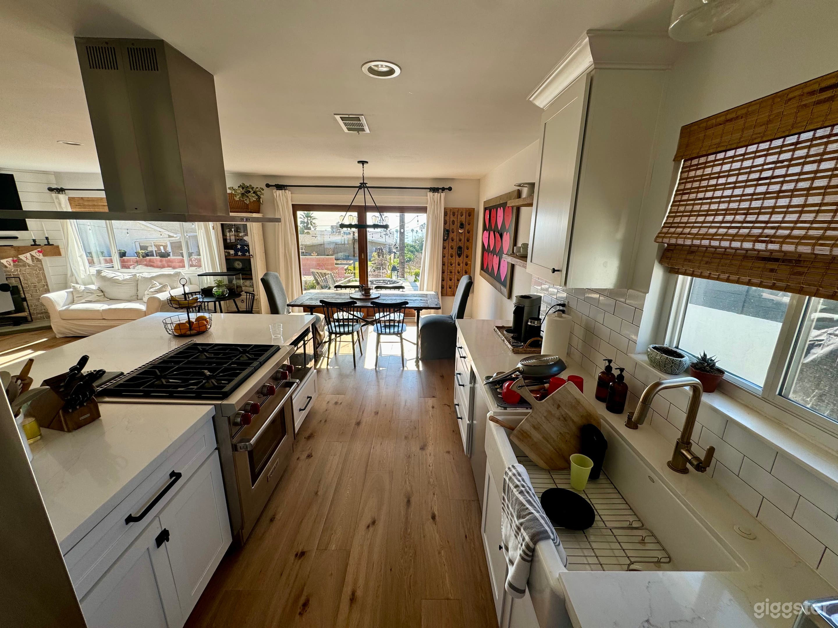 Kitchen with white farmhouse sink and quartz countertops. 