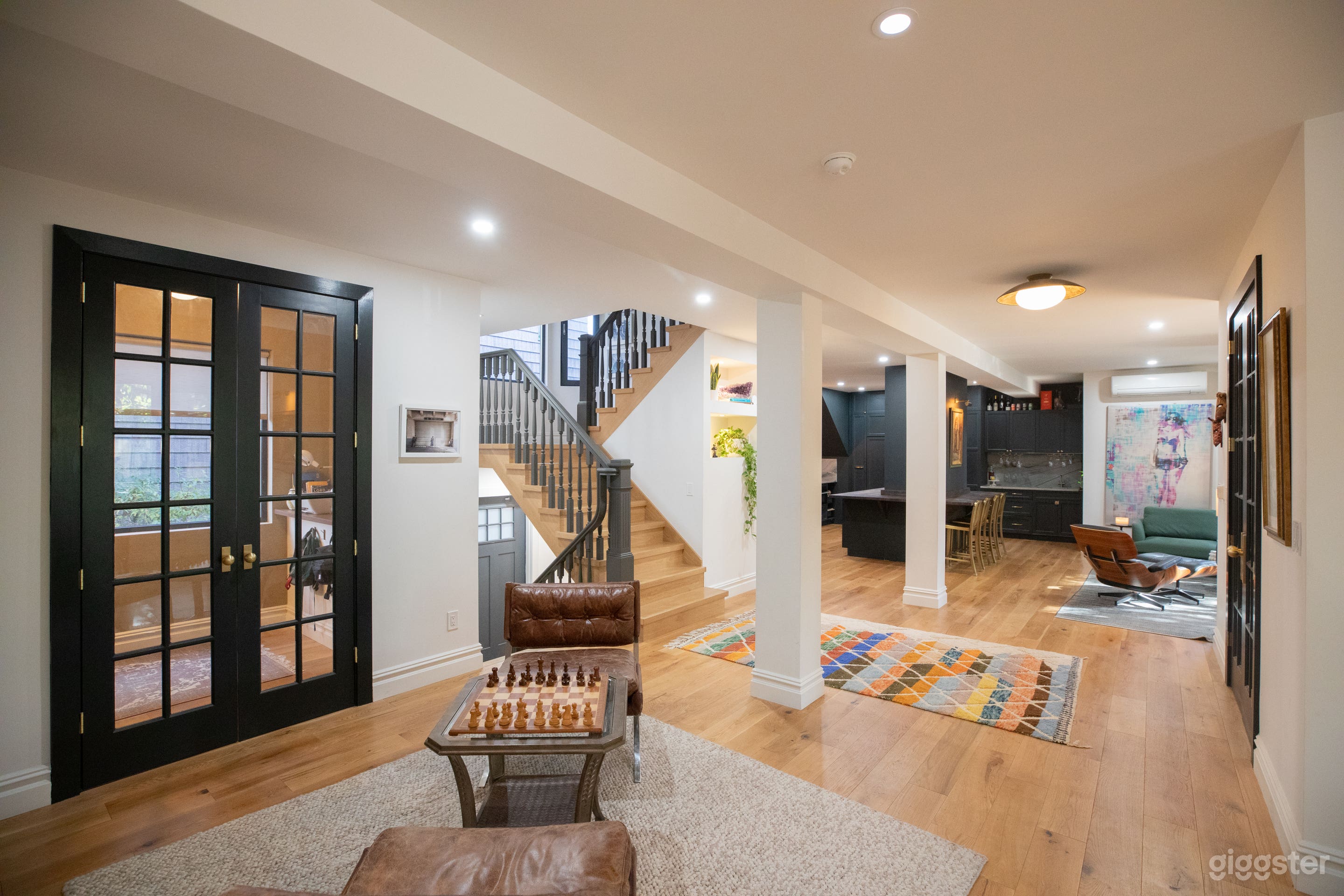 Large open plan space. First floor includes kitchen, living room, dining room, 2 private office and a full tiled bathroom with an oversized standing shower.