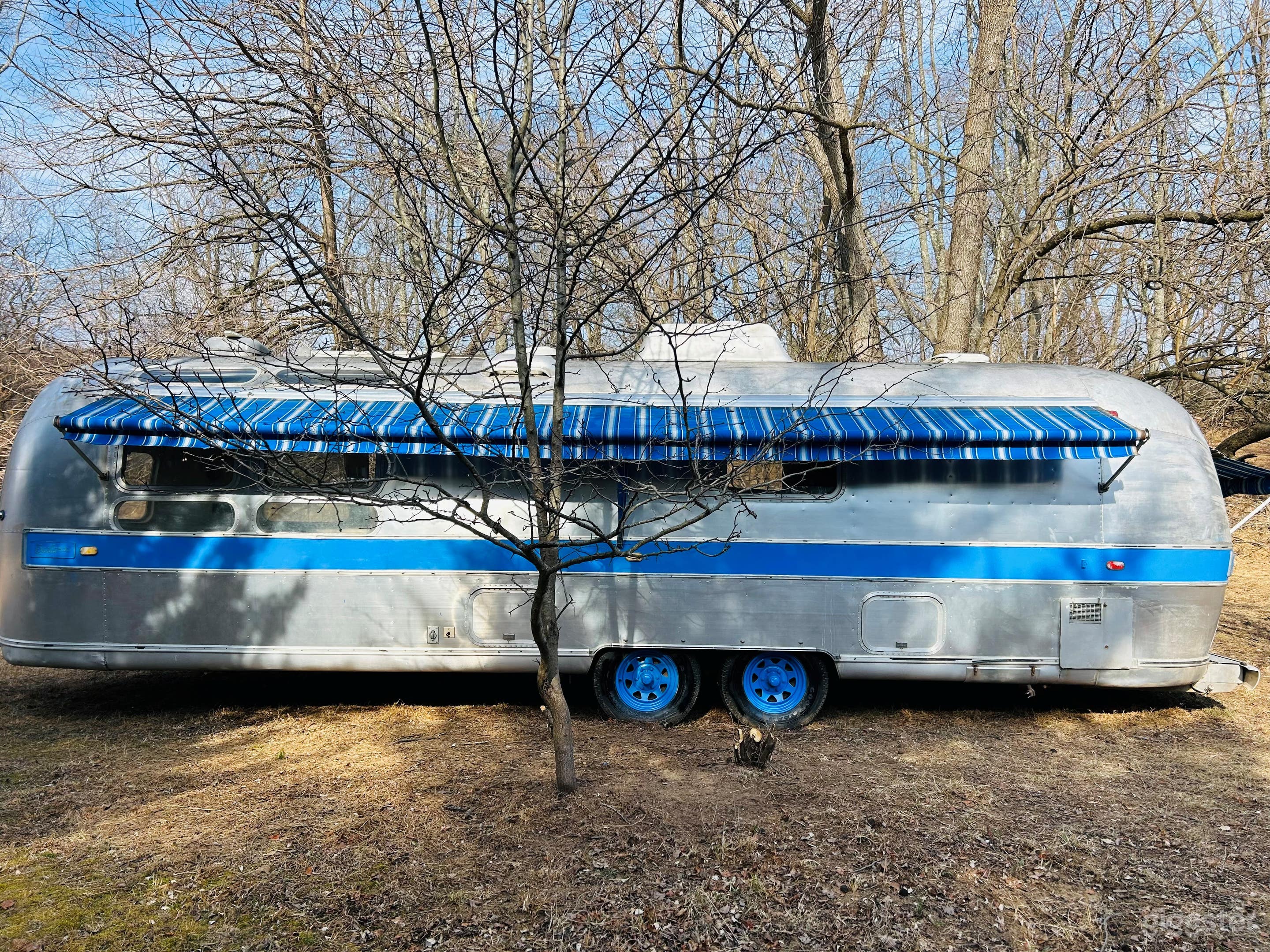 Vintage Airstream in the Woods Photo 4