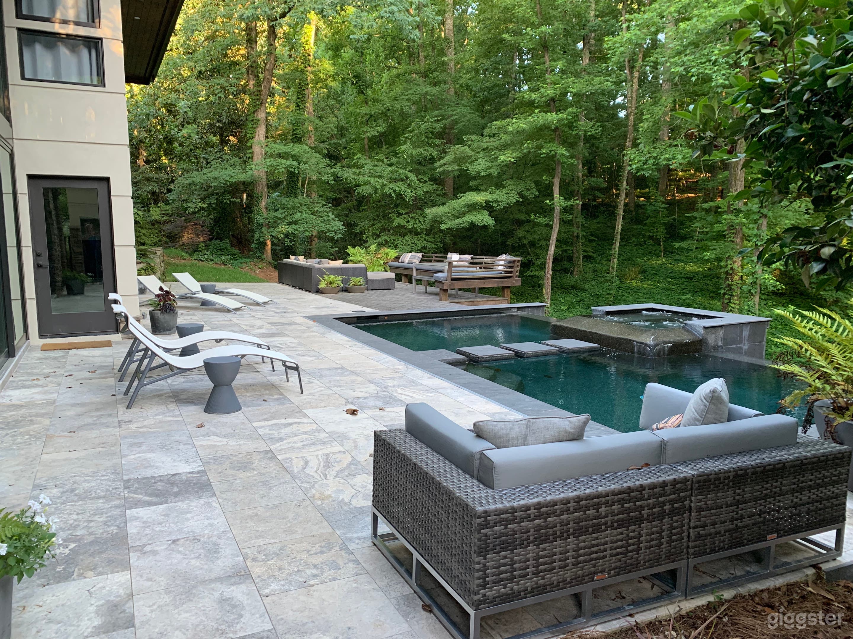 Side view of outdoor space with pool and spa
