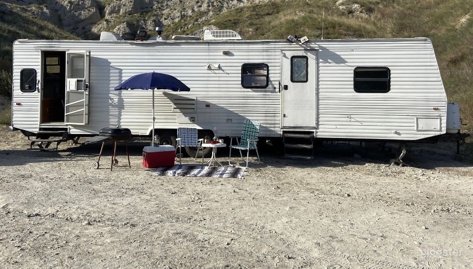 The trailer can be located on a few different spaces on the property. 
This one is up a incline and requires 
a stronger tow vehicle then we have. 
The trailer weighs about 9700 lbs.