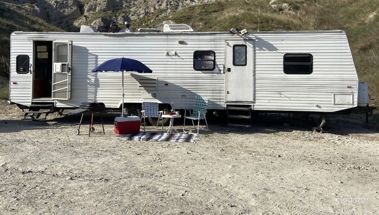  The trailer can be located on a few different spaces on the property. 
This one is up a incline and requires 
a stronger tow vehicle then we have. 
The trailer weighs about 9700 lbs. 