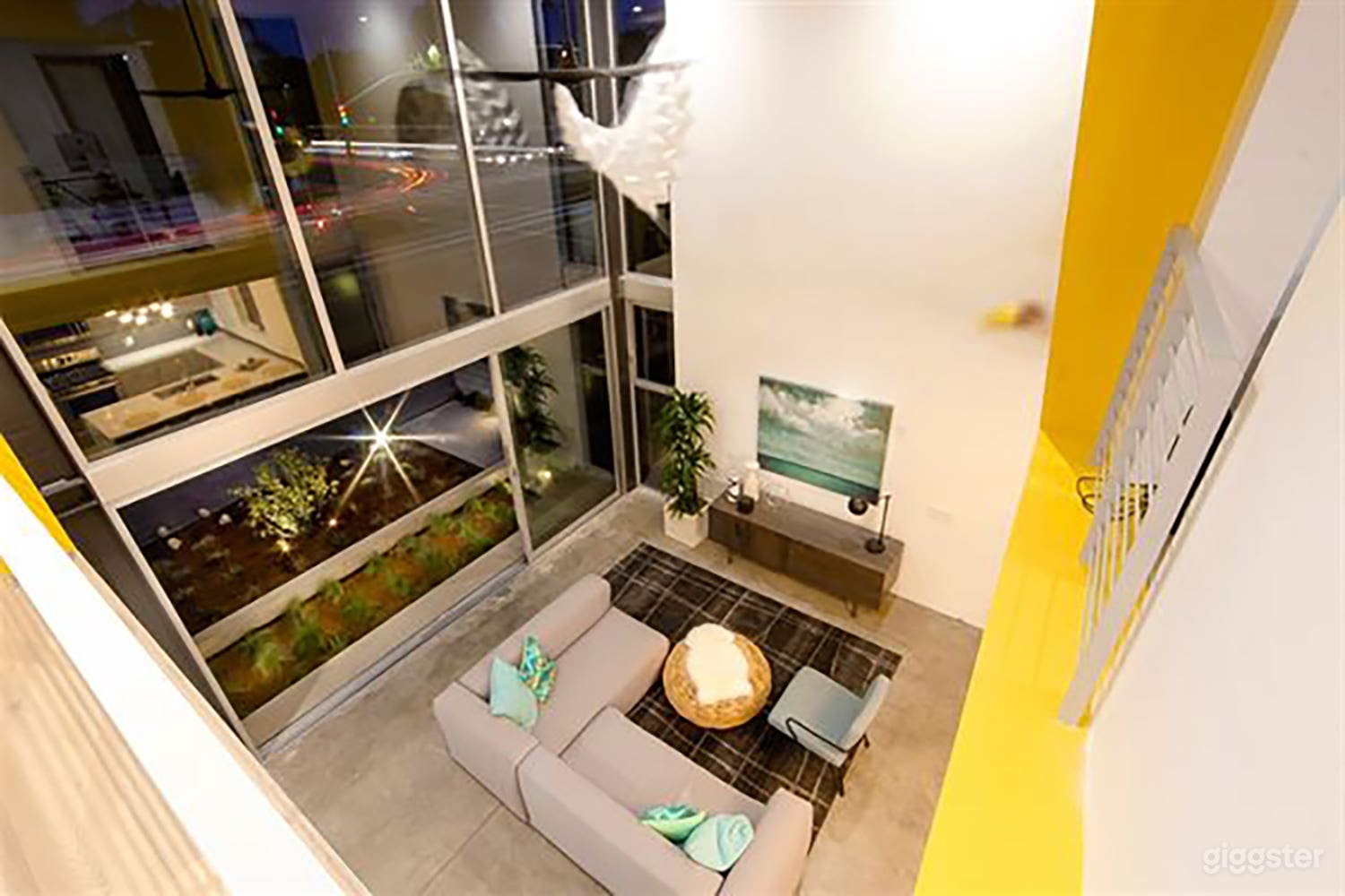 Floor to ceiling window. Shot from the second floor of the living room. 