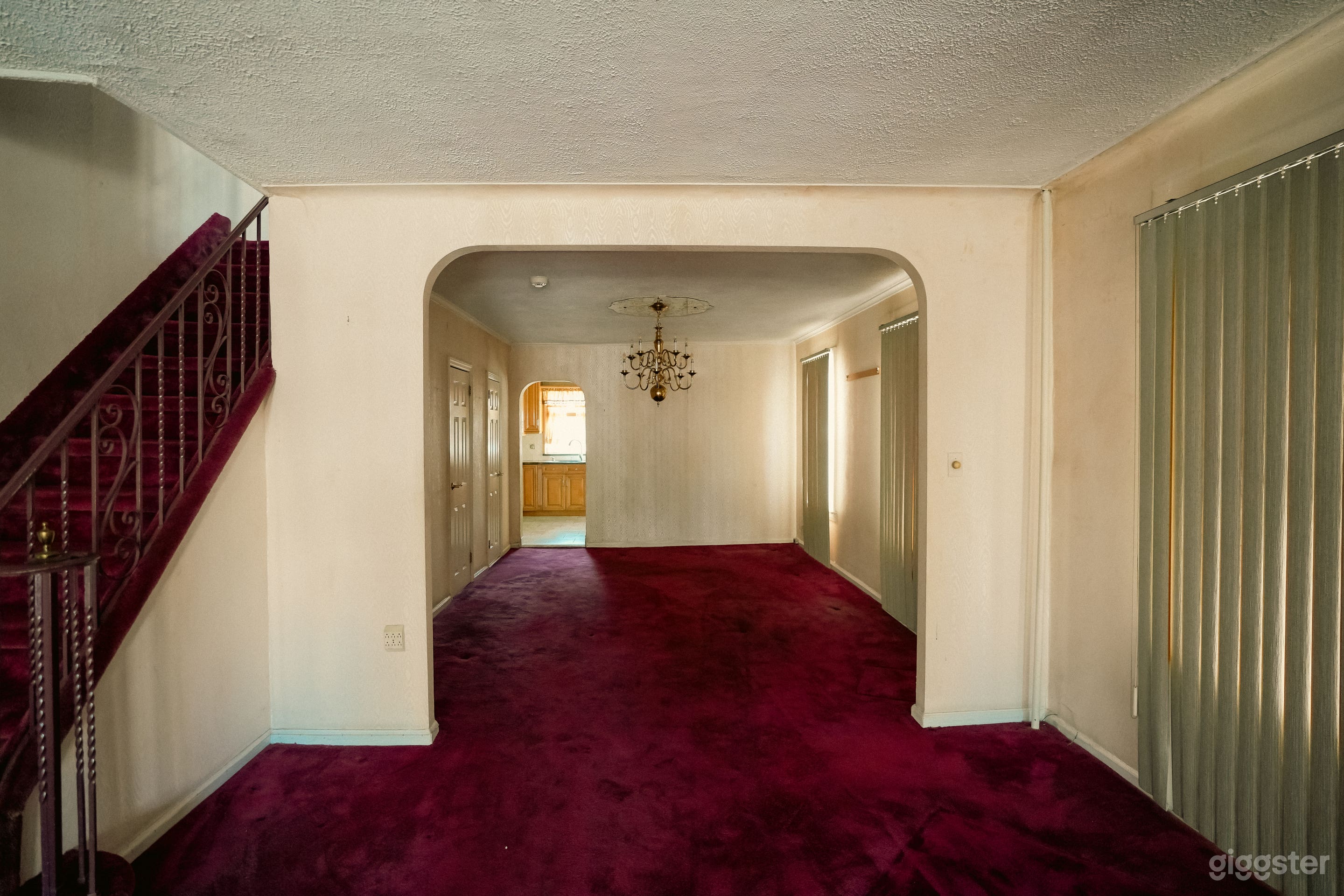 Vacant Home with Pink Carpets, Wallpaper, and Wood Paneling Photo 3