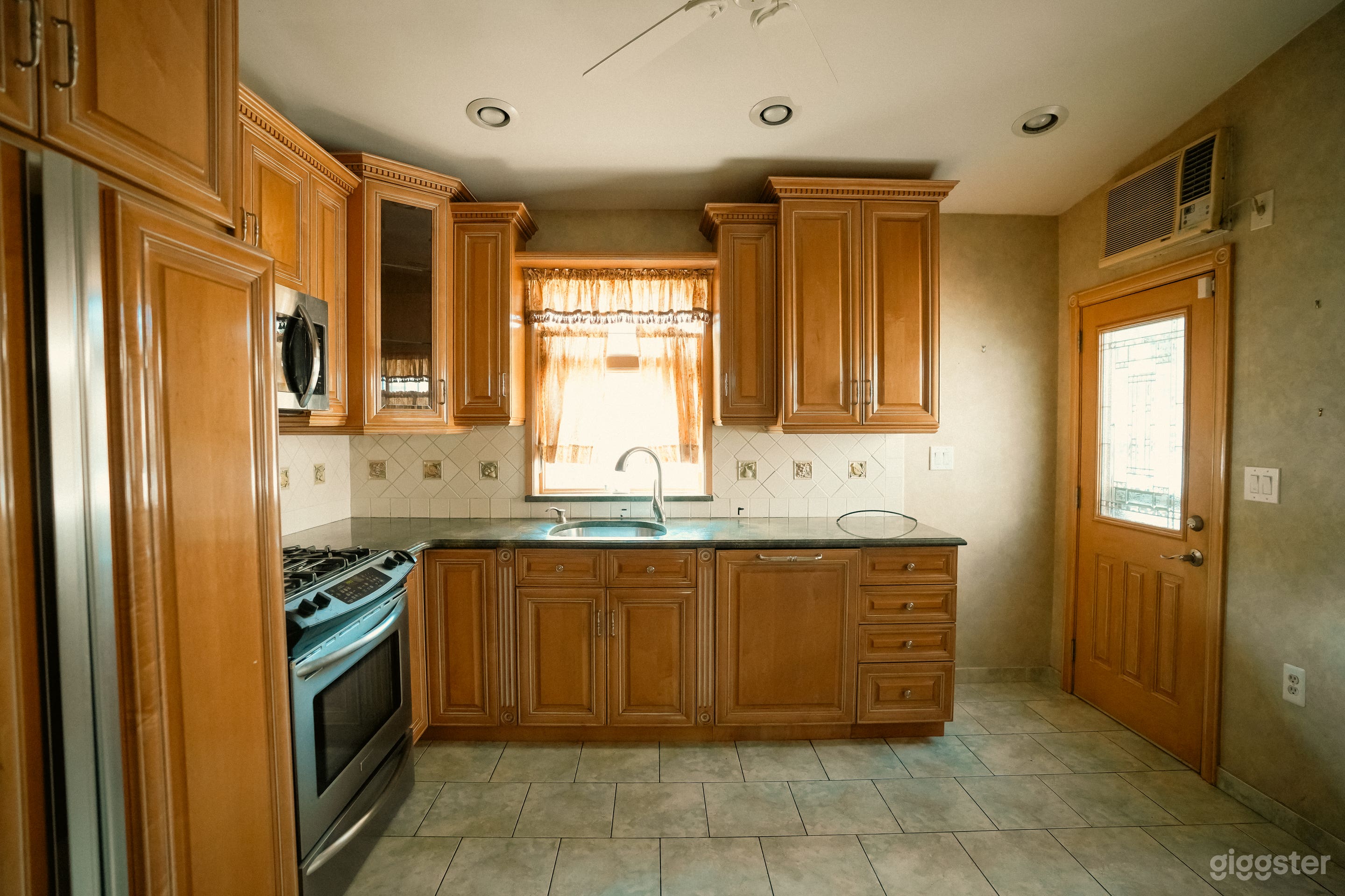 Vacant Home with Pink Carpets, Wallpaper, and Wood Paneling Photo 4