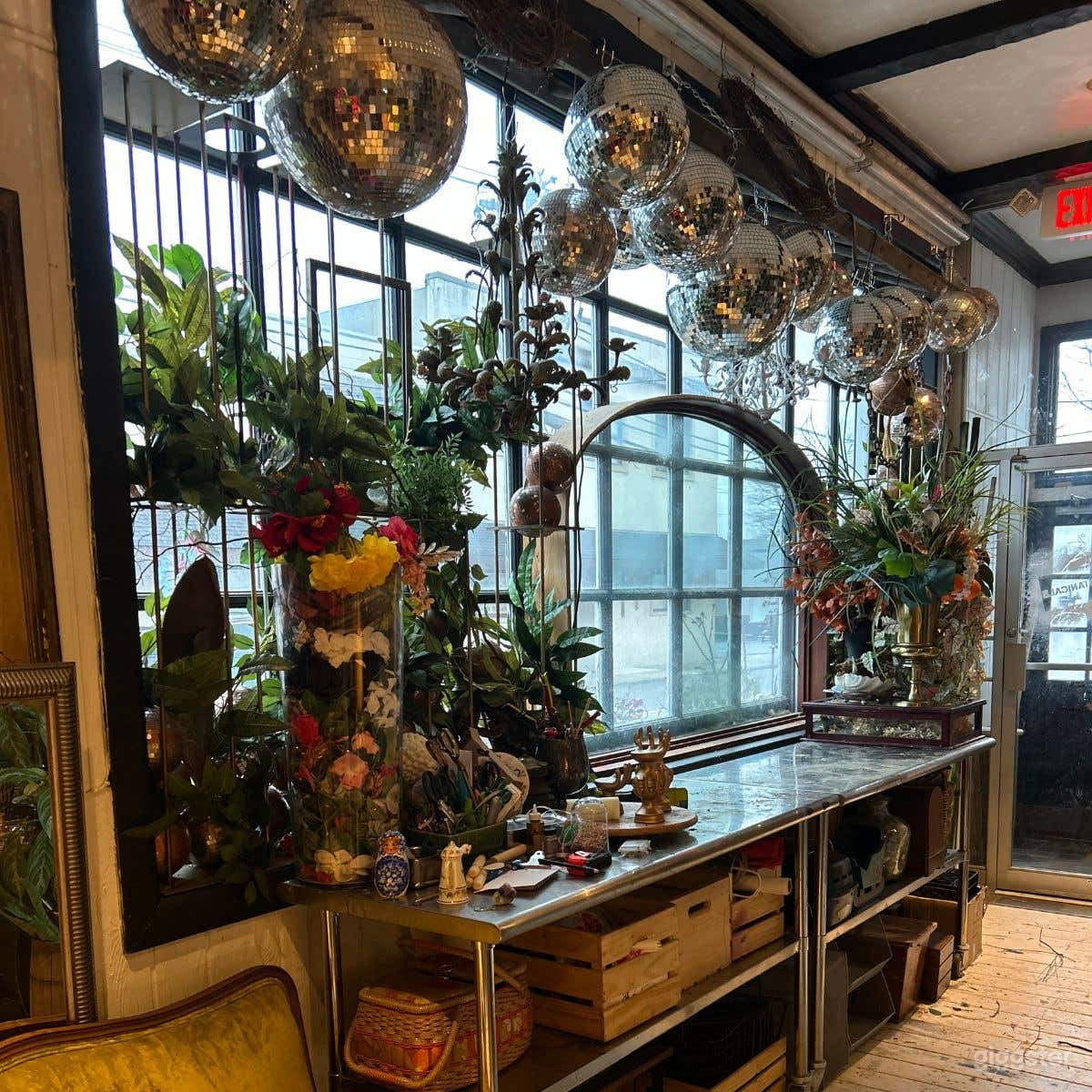 Upstairs natural light pours in from windows into floral shop studio.