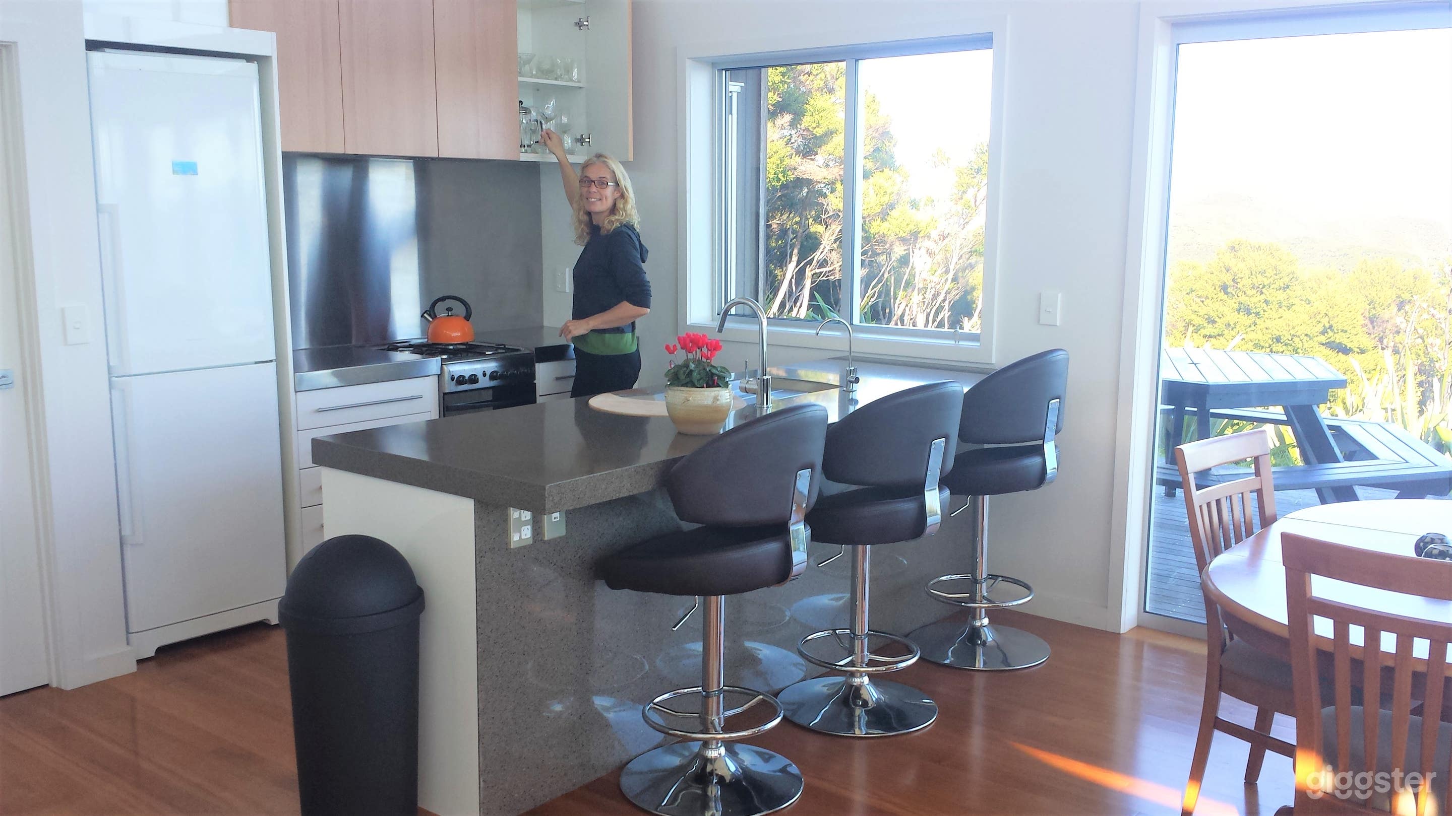 Open plan lounge with kitchen island and bar