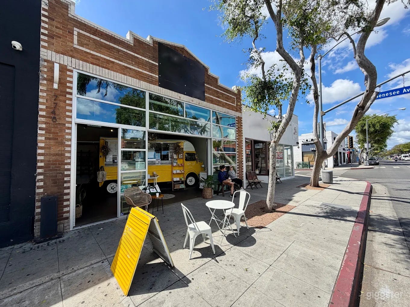 Bright Cafe Dining Space and Backyard Patio Photo 2