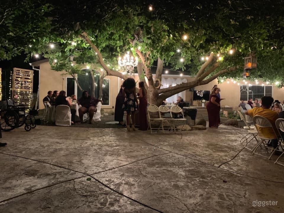 Top of the property - patio under trees at night 