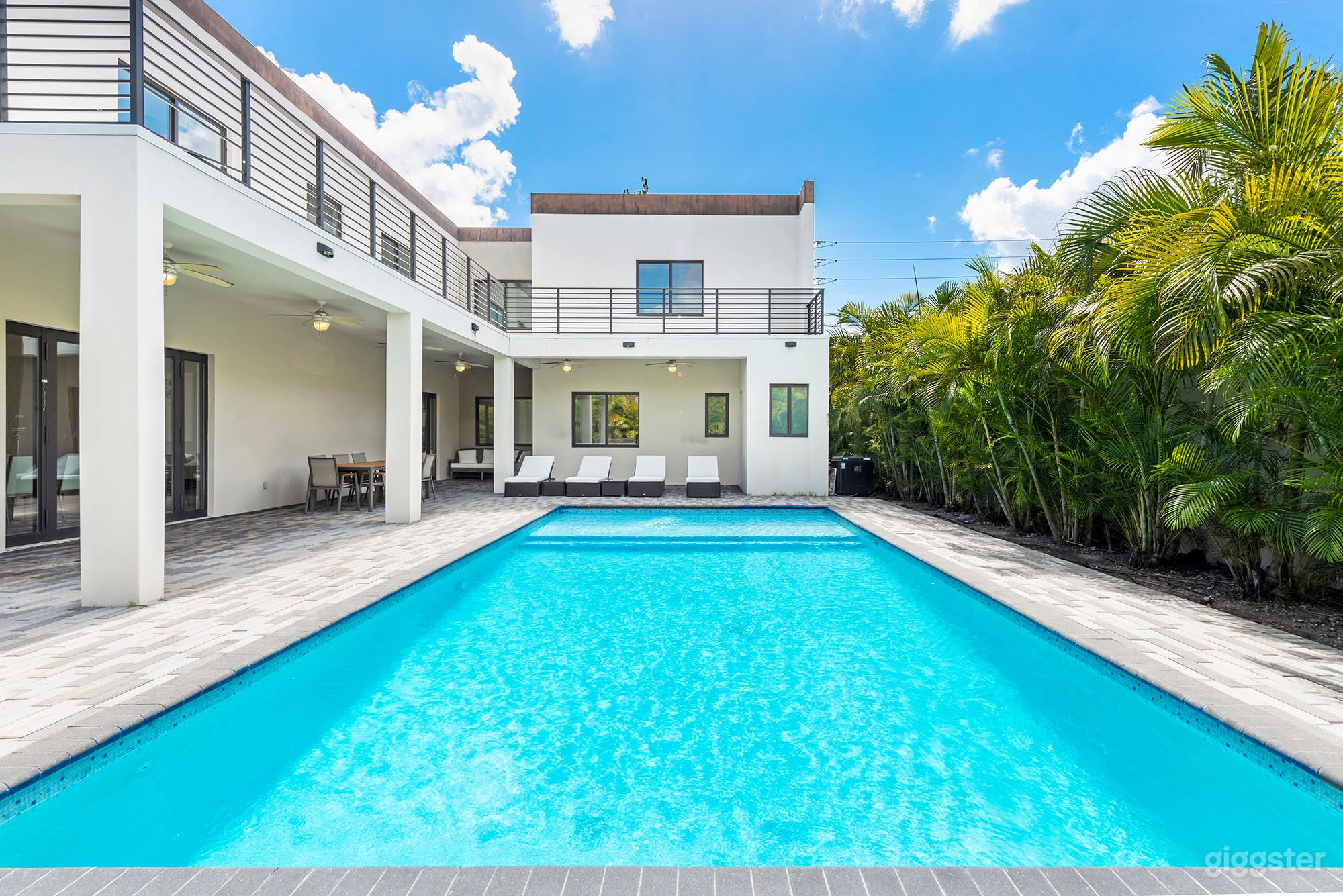 Resort-style pool framed by palms.