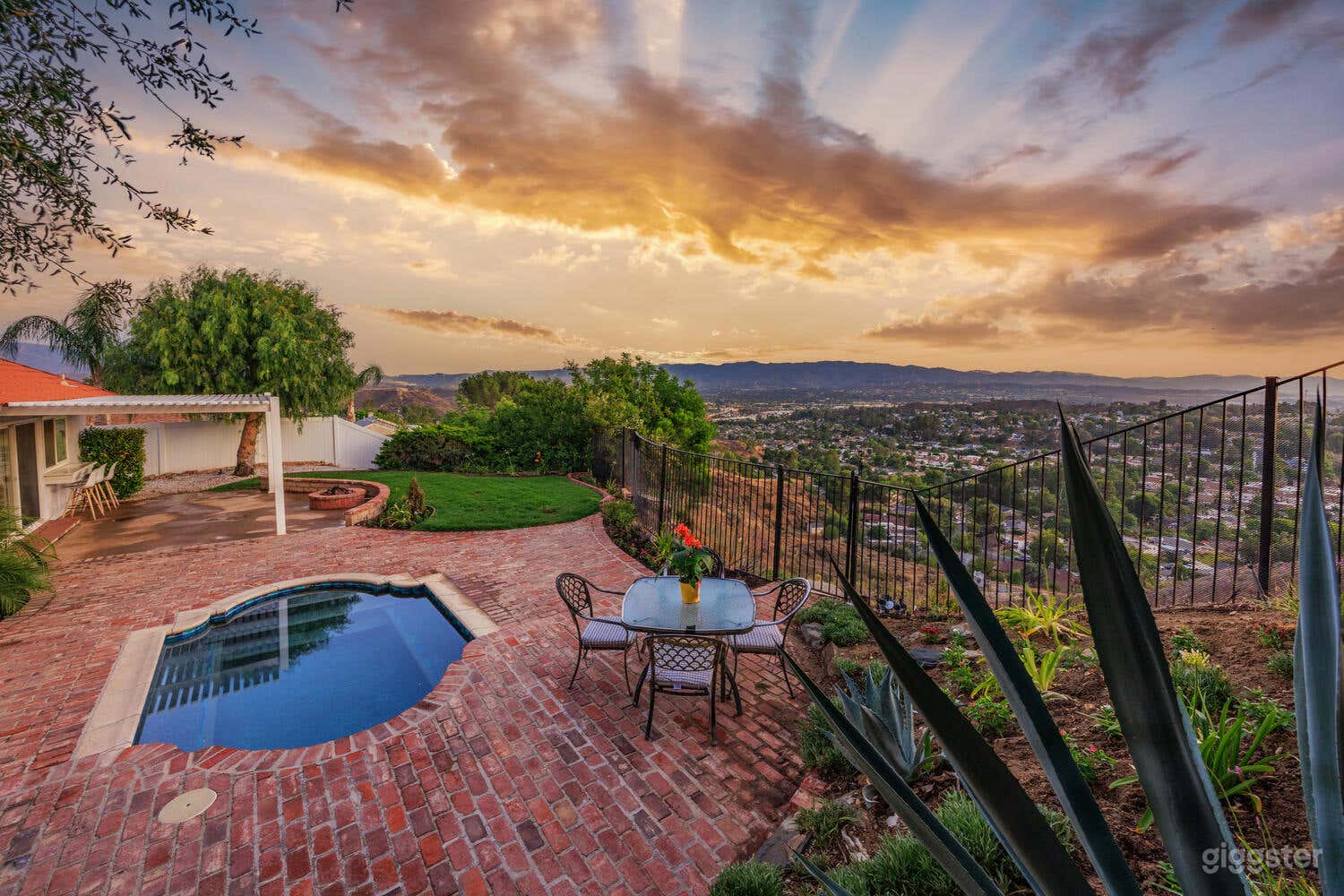 Hilltop Backyard With Sunset and City Night Lights View Photo 1