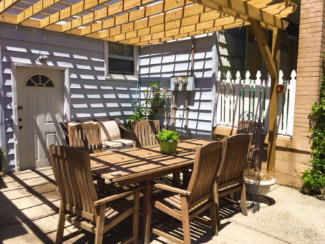 Vibrant Backyard With Table Photo 3