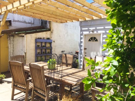 Vibrant Backyard With Table Photo 2