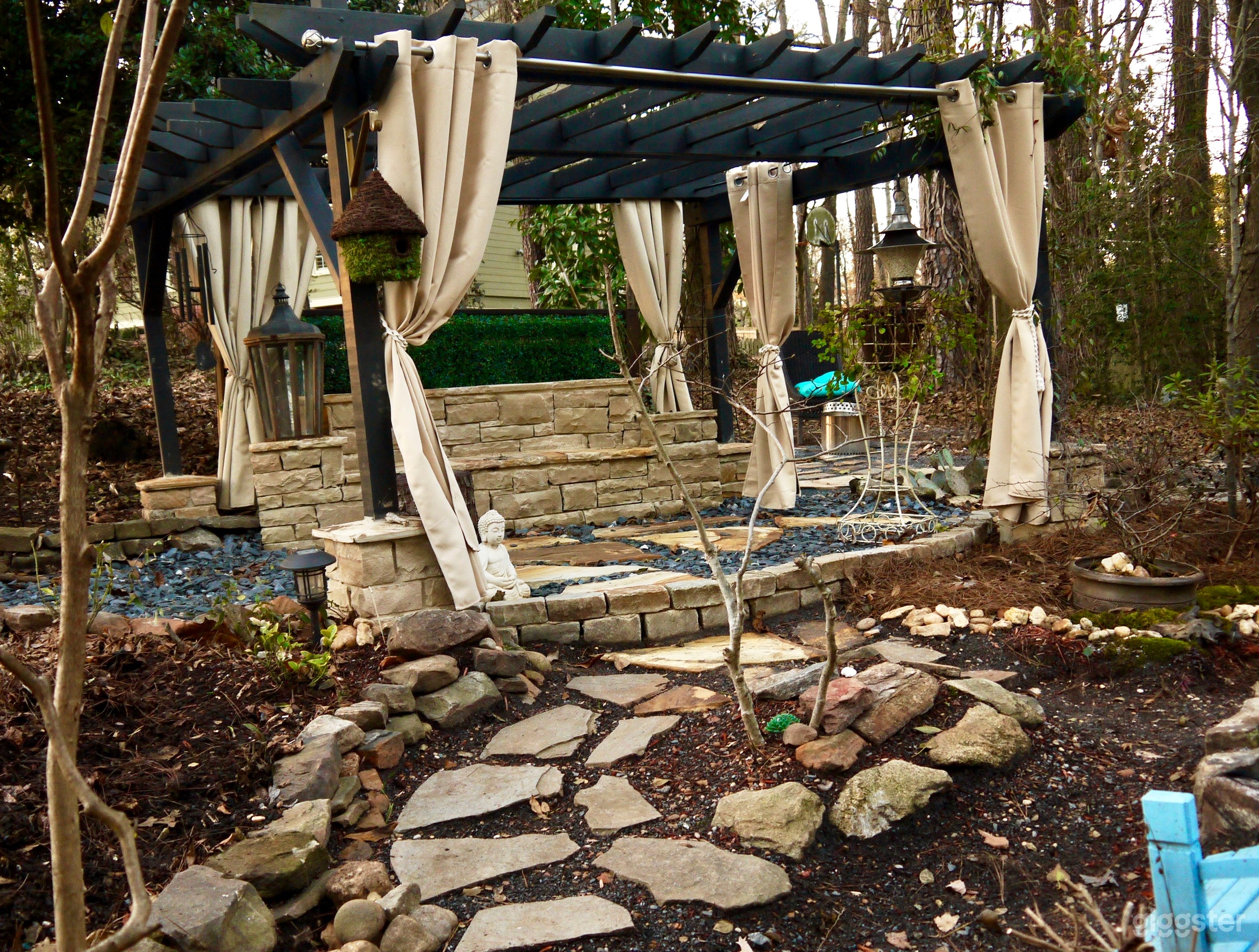 Stone bench under our garden pergola