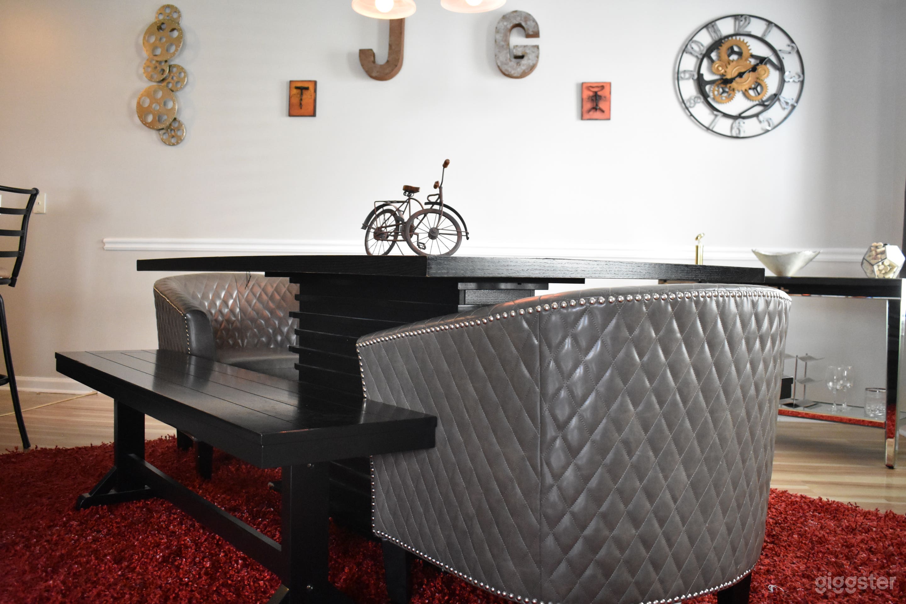 Dining room with bench seating and club chairs