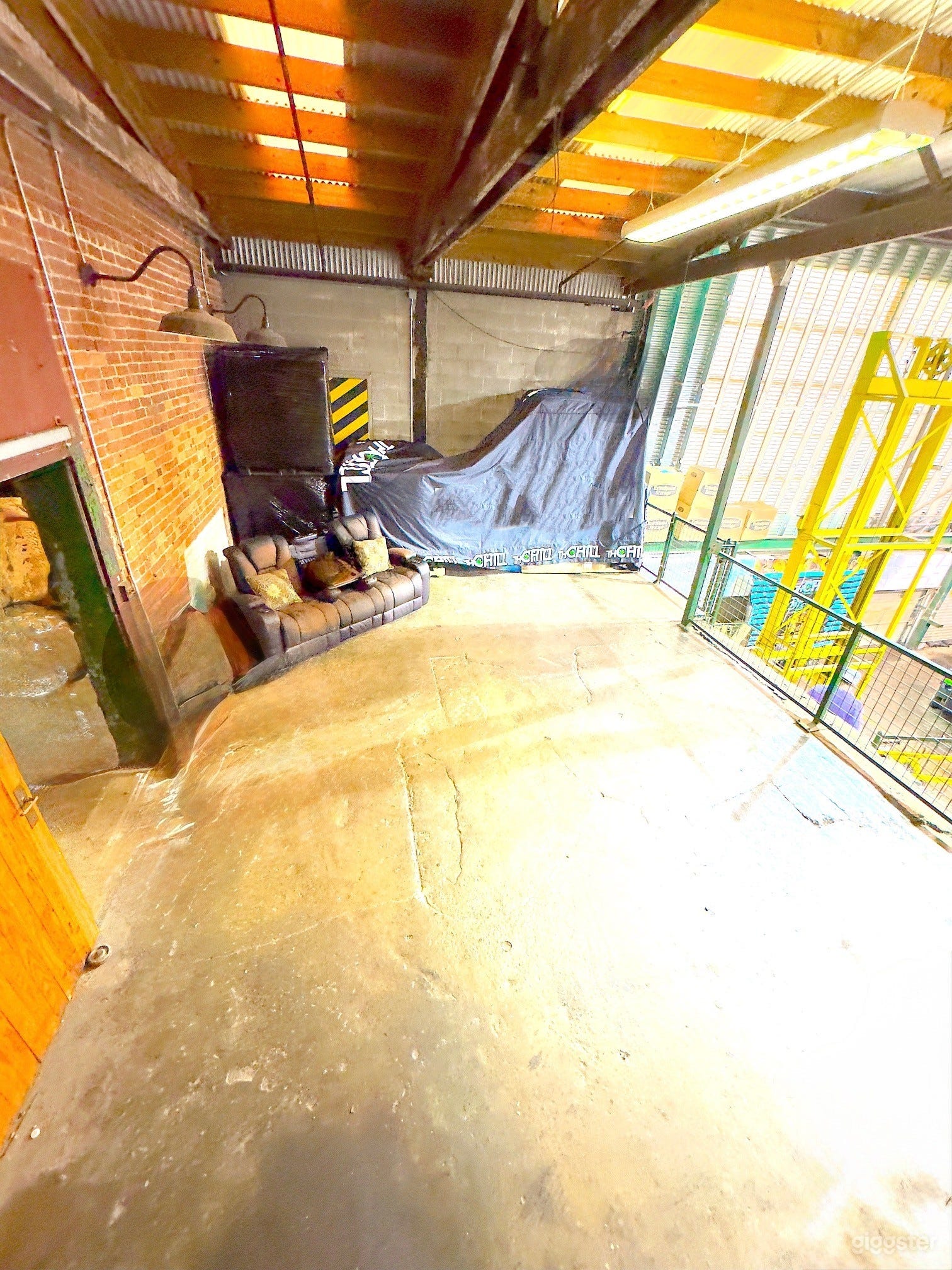 Modern industrial space with warm lighting and exposed brick—ideal for events, shoots, or gatherings on the Beltline.