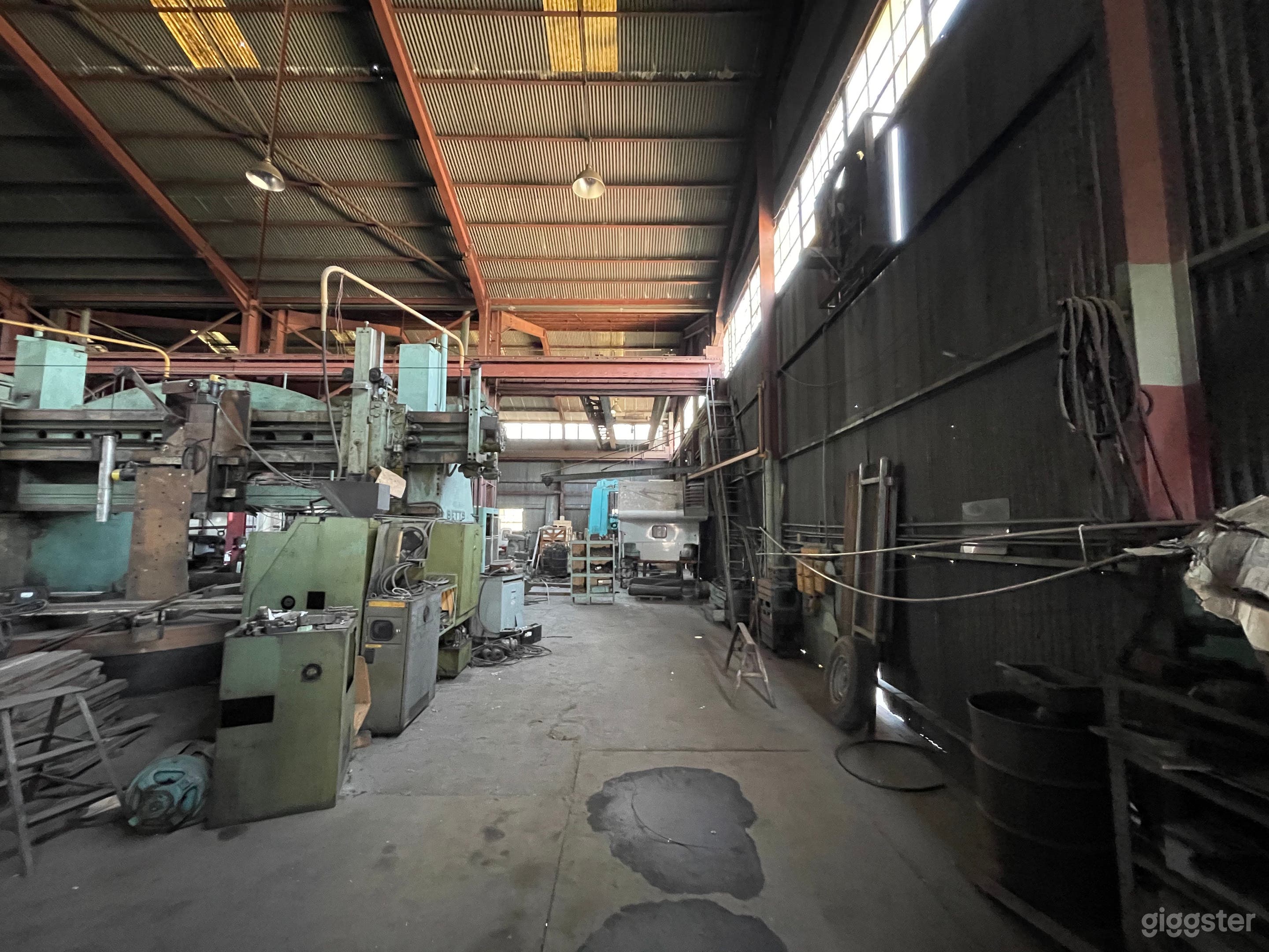 Massive Metal Shop Warehouse with Heavy Machinery Photo 2