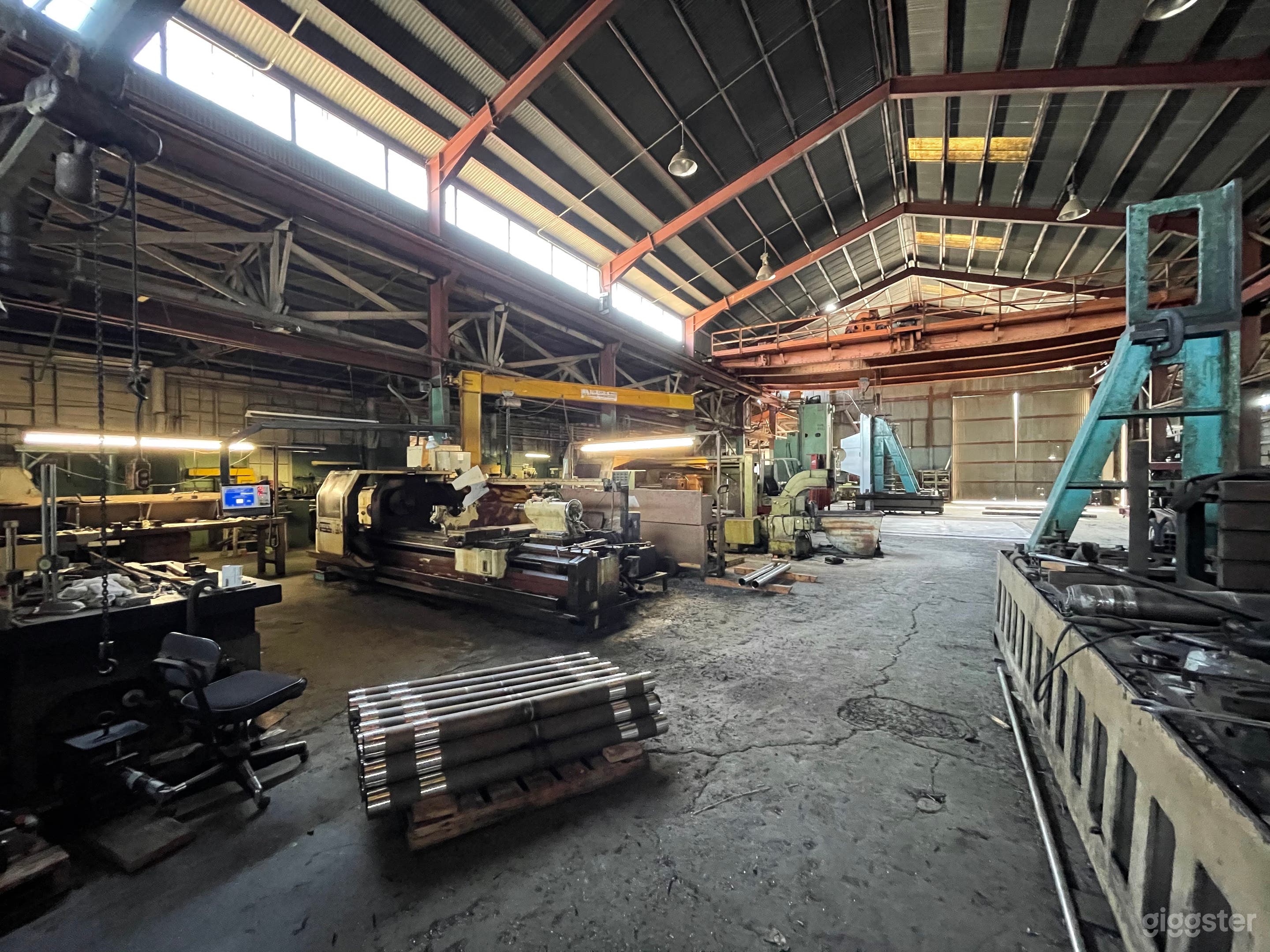 Massive Metal Shop Warehouse with Heavy Machinery Photo 1