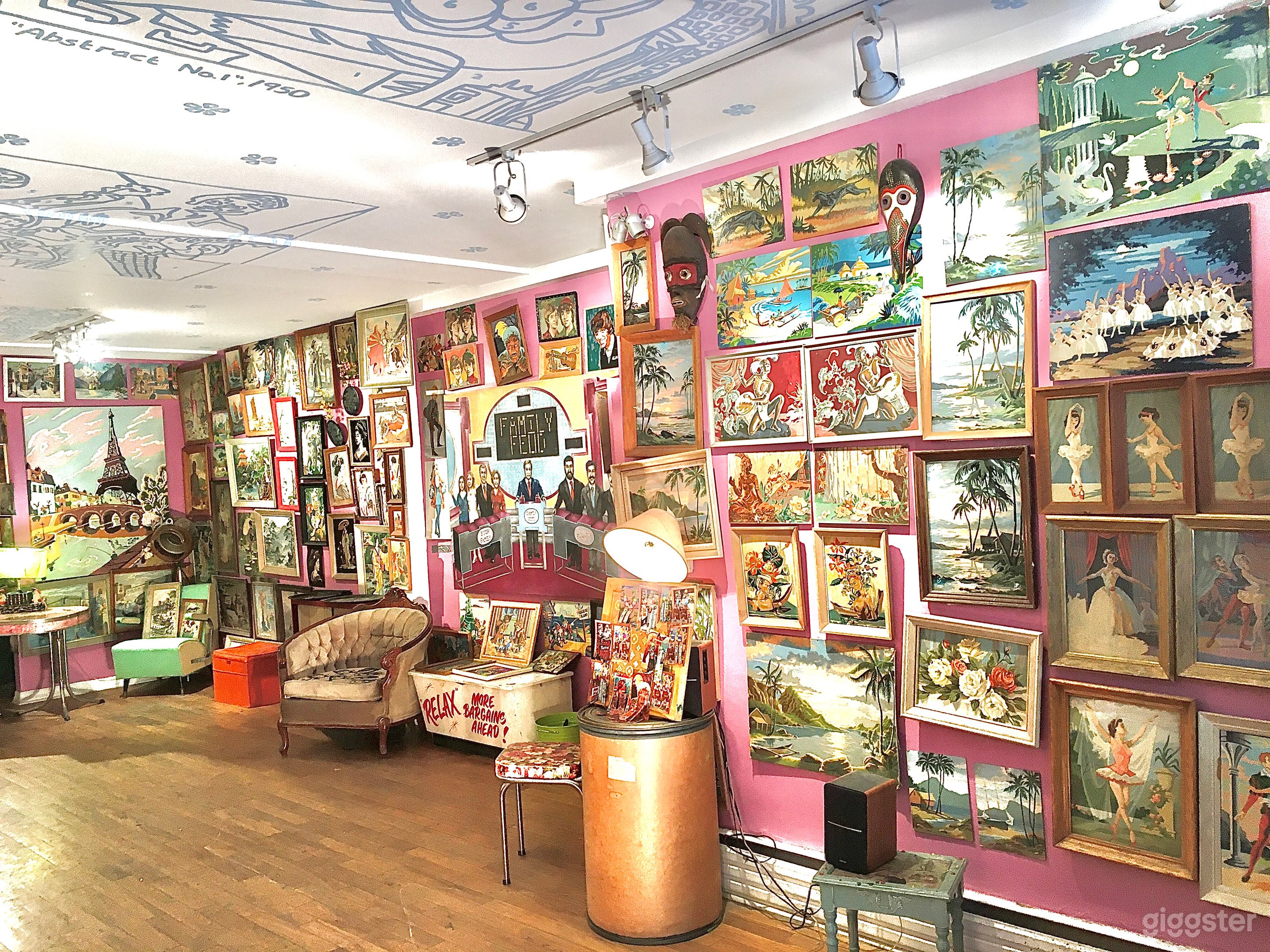 Mid Century Art Filled Pink Storefront Space Photo 2