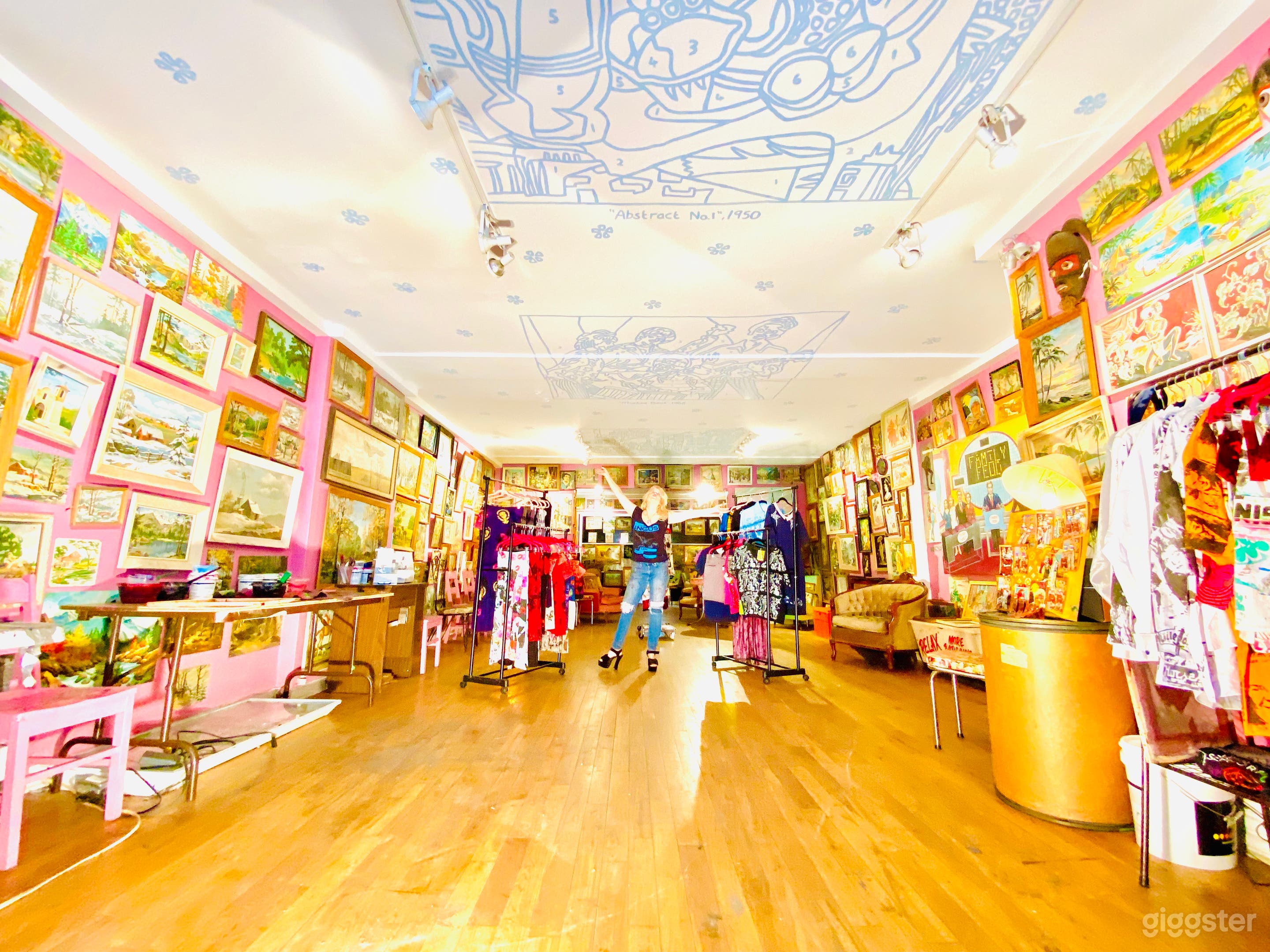 Mid Century Art Filled Pink Storefront Space Photo 1