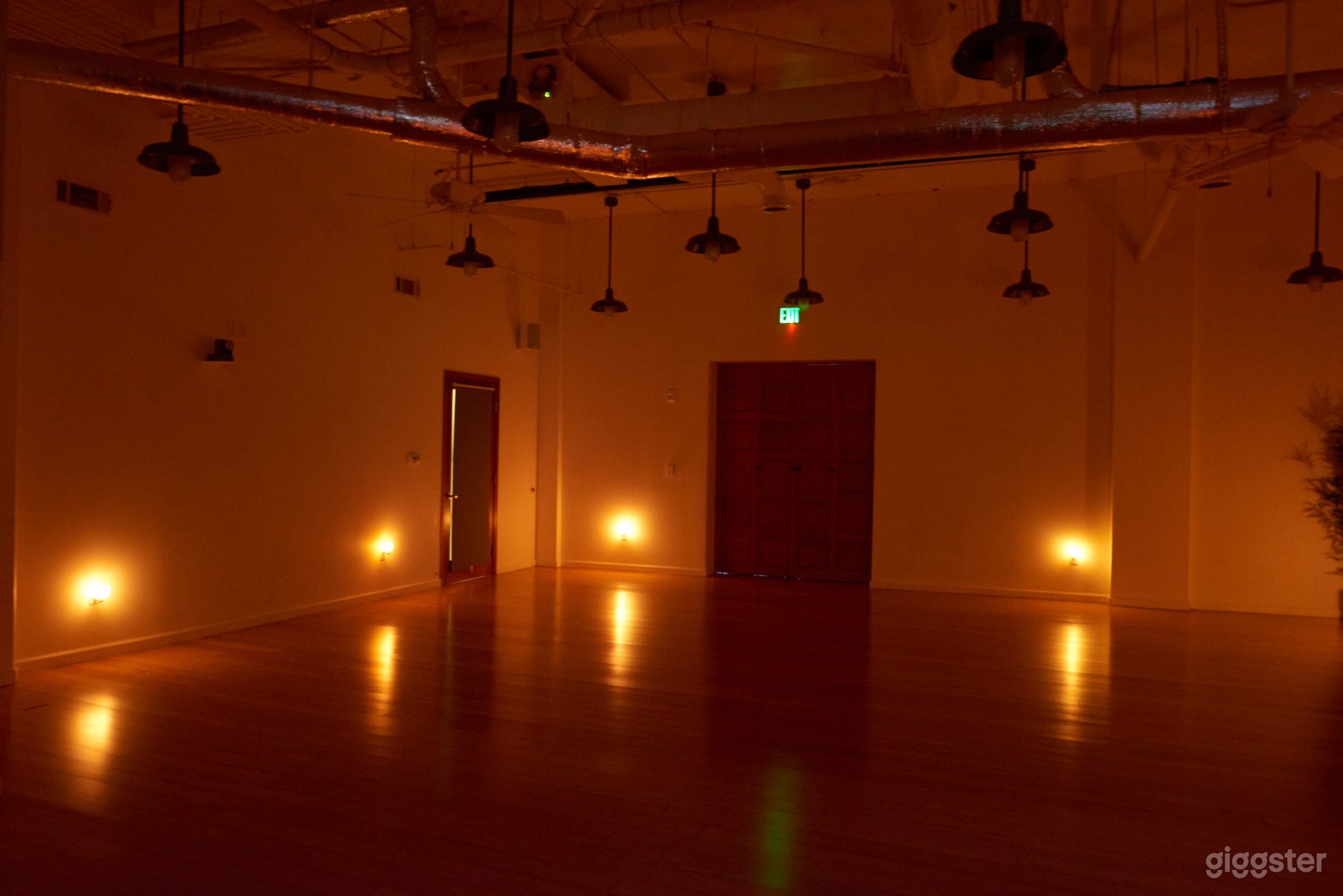 Lotus Room: $90 an hour (price break on multiple hours). Spacious, high ceilings, hardwood floors, great sound system, extra wide wood doors for loading in, quiet air-conditioning and heat. Small production film equipment. Yoga props, candles included.