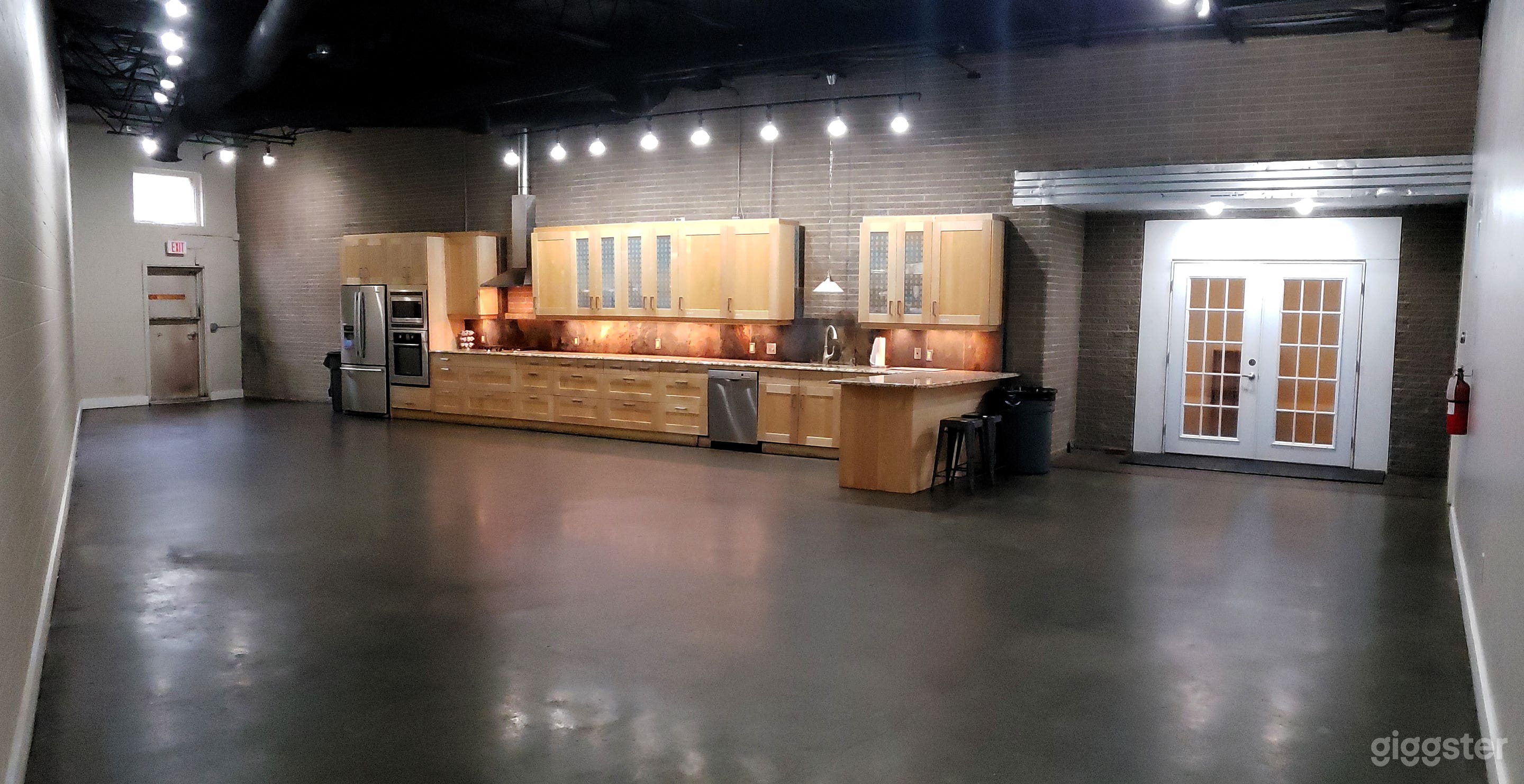 The Kitchen with Outdoor Deck Photo 1