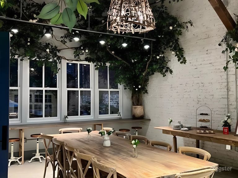  Charming and whimsical florals adorn the walls and ceiling, creating a magical garden setting. 