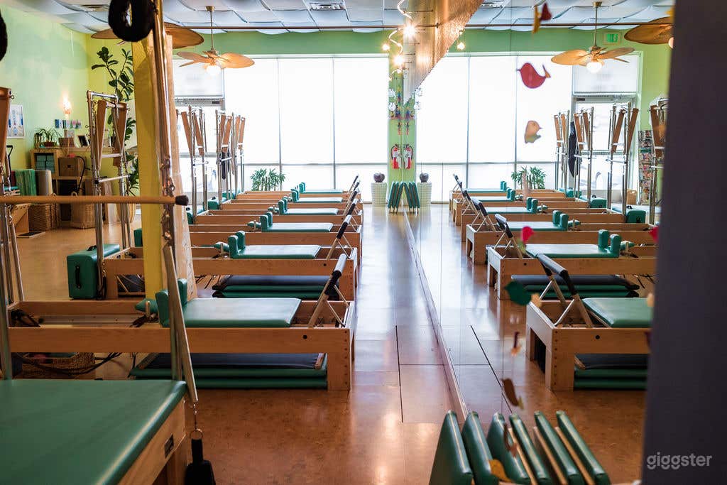 Interior view facing the front of the studio- lots of natural light! Mirrors along one whole wall.