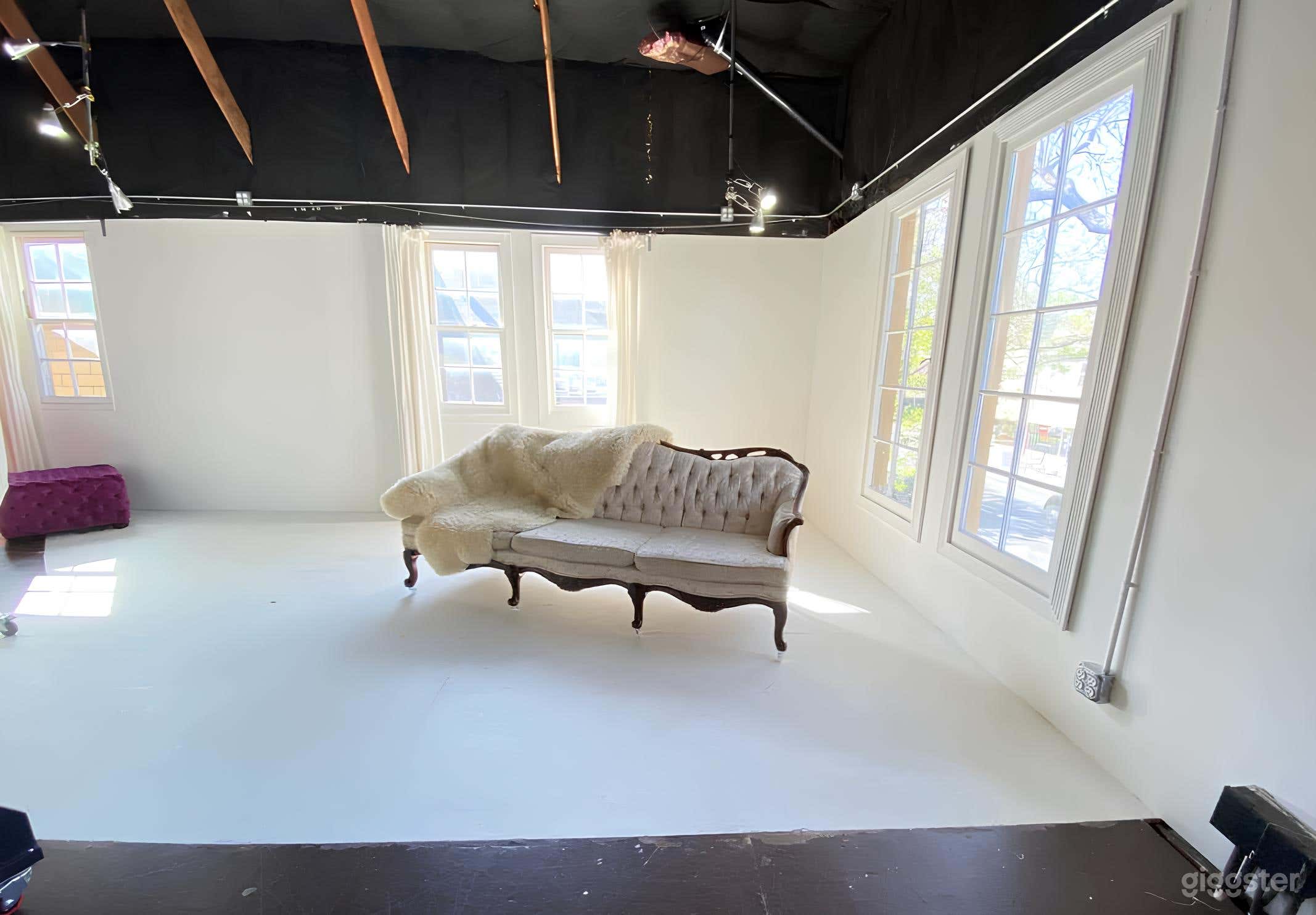 North-West corner with bright afternoon sunlight, cream vintage sofa on wheels