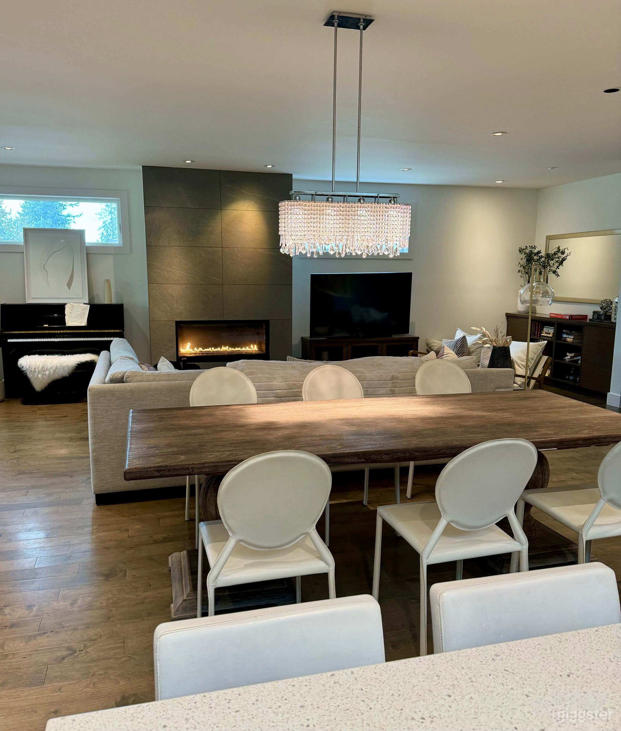 Great room with gas fireplace with modern tile.