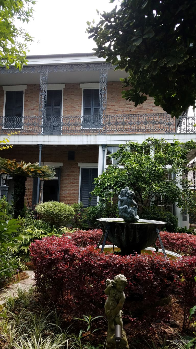  Courtyard with a greenhouse in the background 