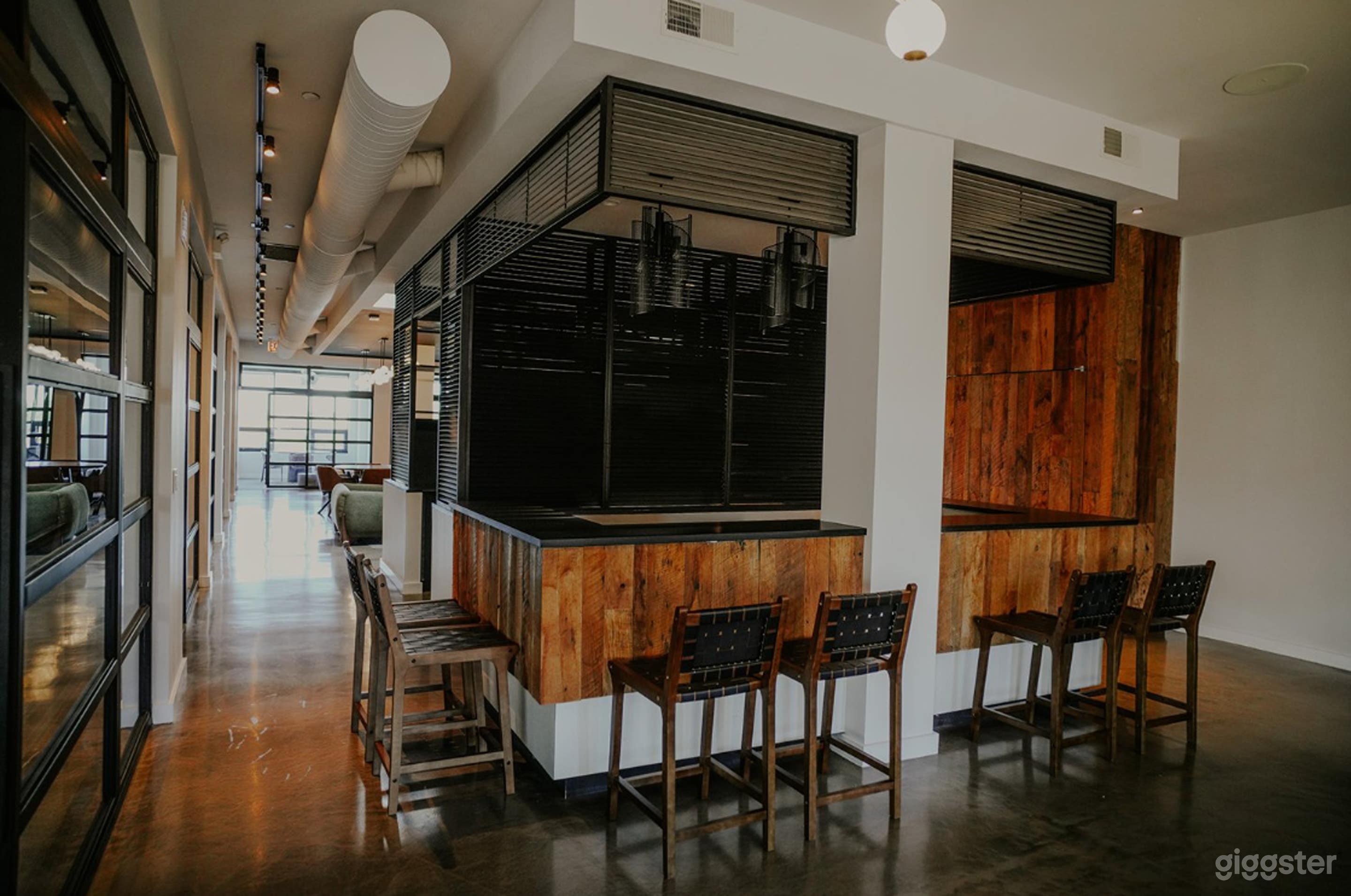 Stylish Office Dining Area with Modern Communal Seats Photo 2